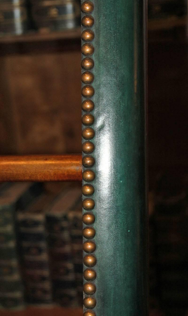 A C. Mariani custom mahogany folding library ladder in the English taste, with forest green leather sides, available in custom colors and with brass nailhead trim, please call for a custom quote.