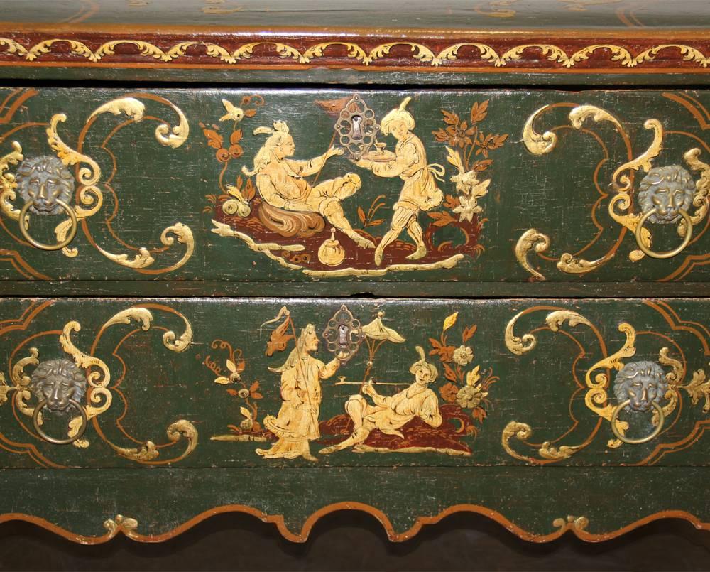 An 18th century Italian lowboy chinoiserie polychrome commode with two functioning drawers, the top, front and sides painted with whimsical pictorial scenes, the whole resting atop cabriole legs and terminating in slippered feet.