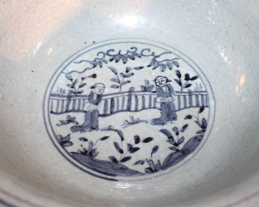 A large 19th century rustic Chinese blue and white glazed bowl.