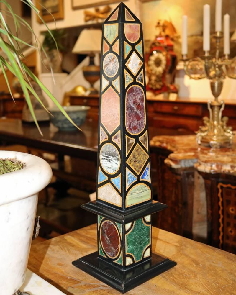 A colorful pair of Specimen marble and other semi-precious stone Obelisks including lapis lazuli, slate, Siena marble and other vibrant hardstones.