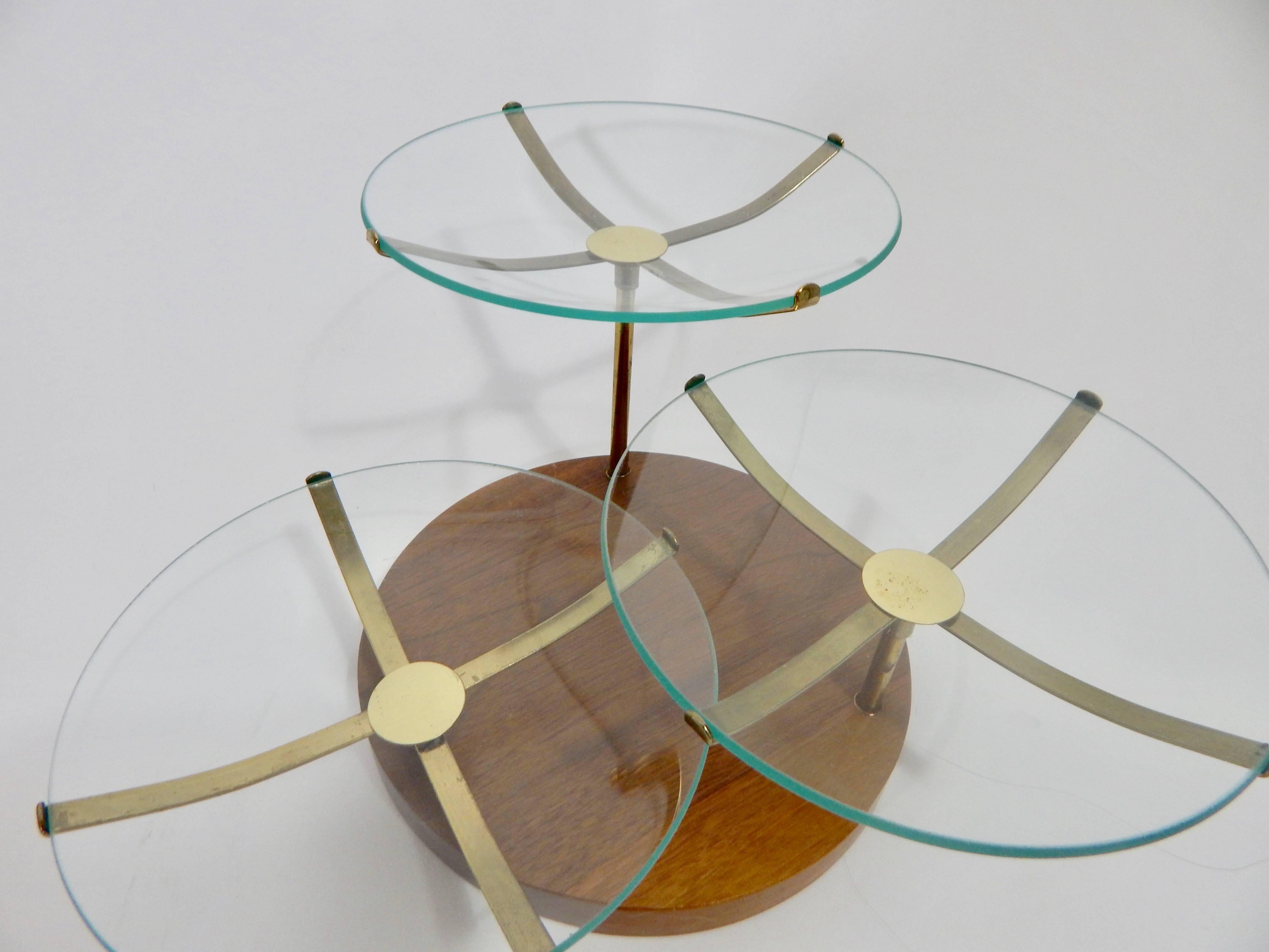 1960s three-tiered serving dish. Walnut wood base. Brass holding stands and glass plates.