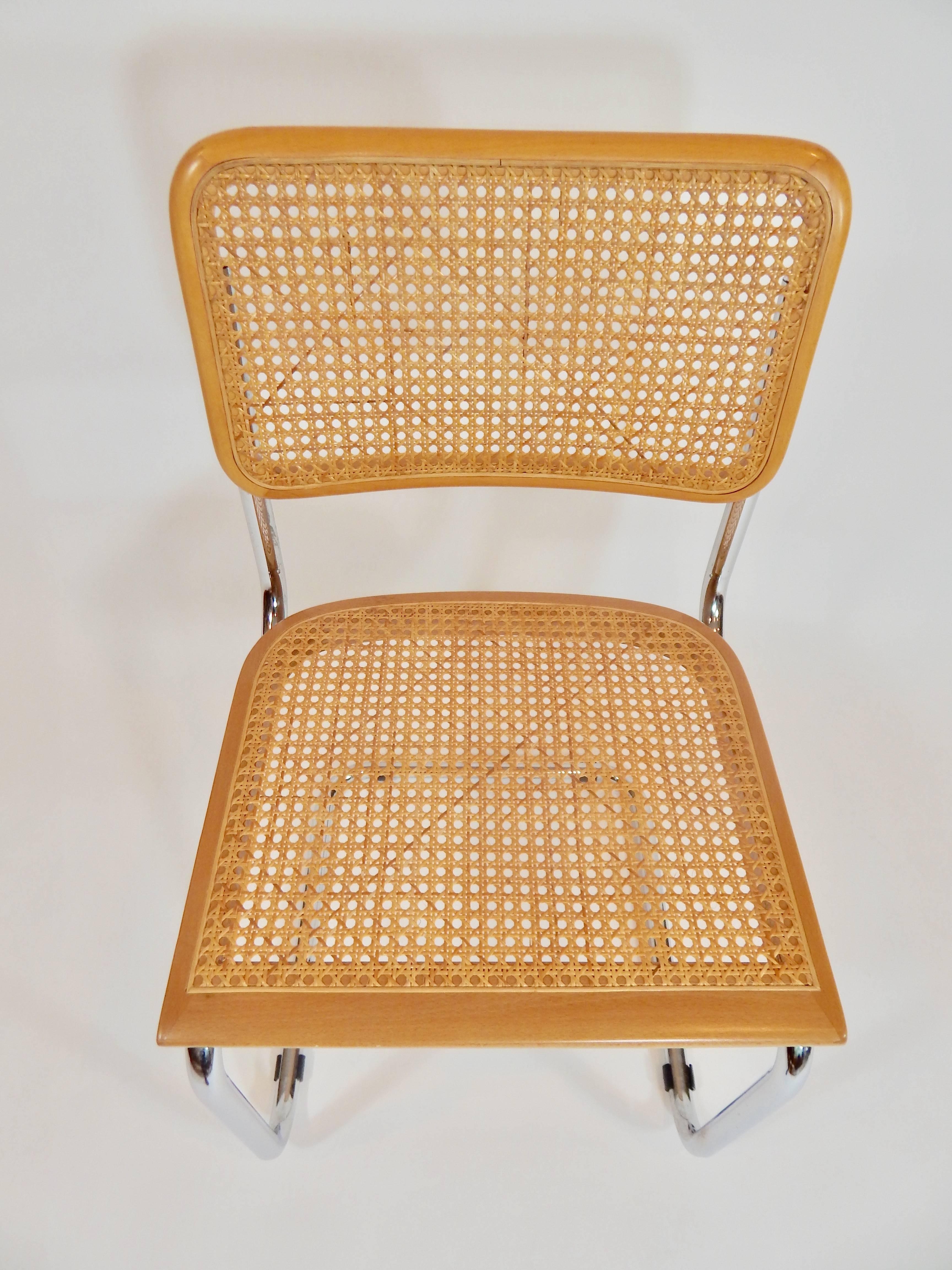 Pair of Midcentury Marcel Breuer Cane Cesca Chairs with chrome frame. Dining chair or side chair. Marked Made in Italy. Please inquire if you are in need of multiples. 