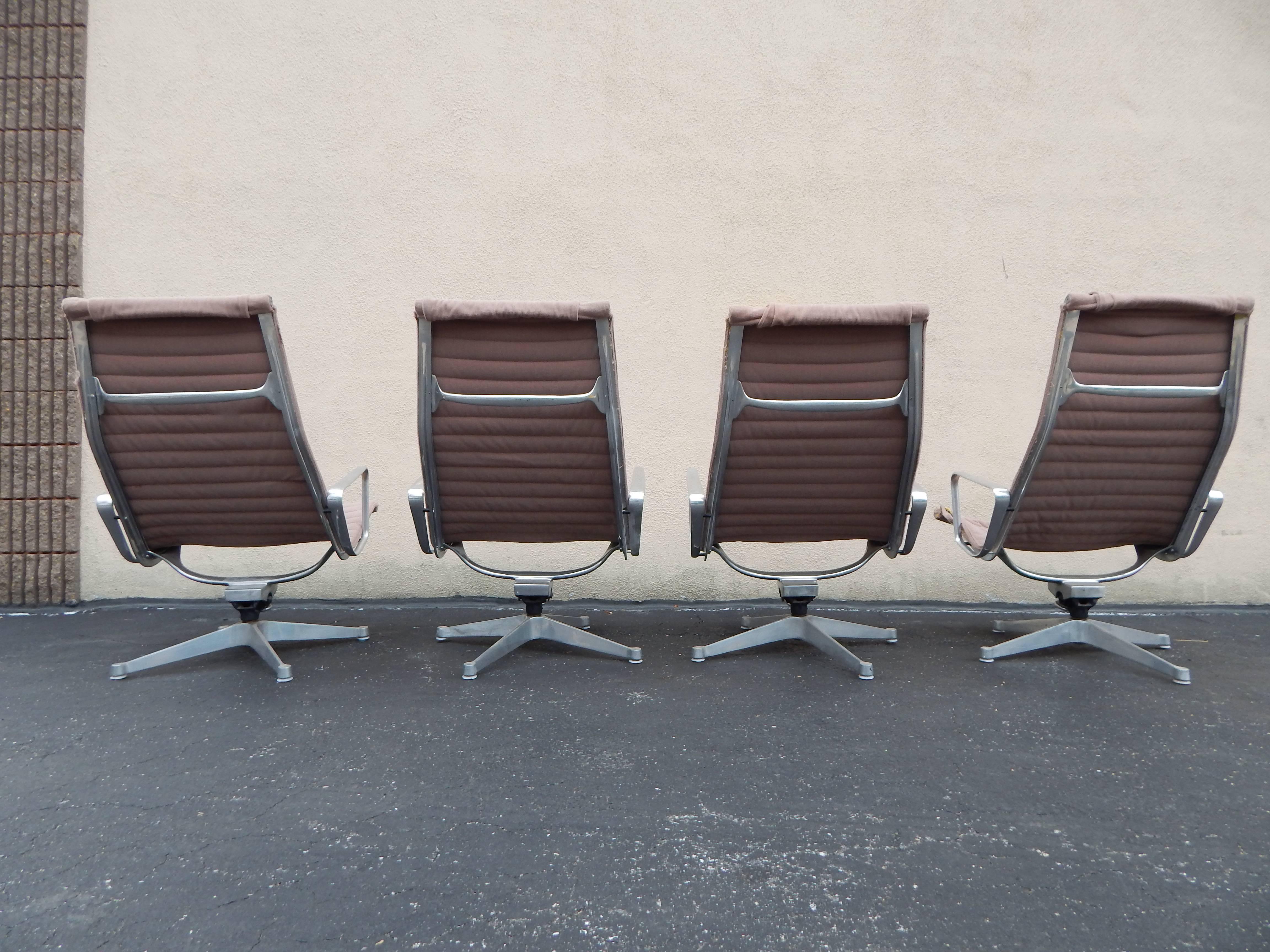 Early model 1970s Eames designed for Herman Miller Lounge or Lounger chairs. Price is for the entire group of 4. All chairs are in need of new upholstery. All chairs are in excellent operating and functioning condition. All swivel with ease. Steel