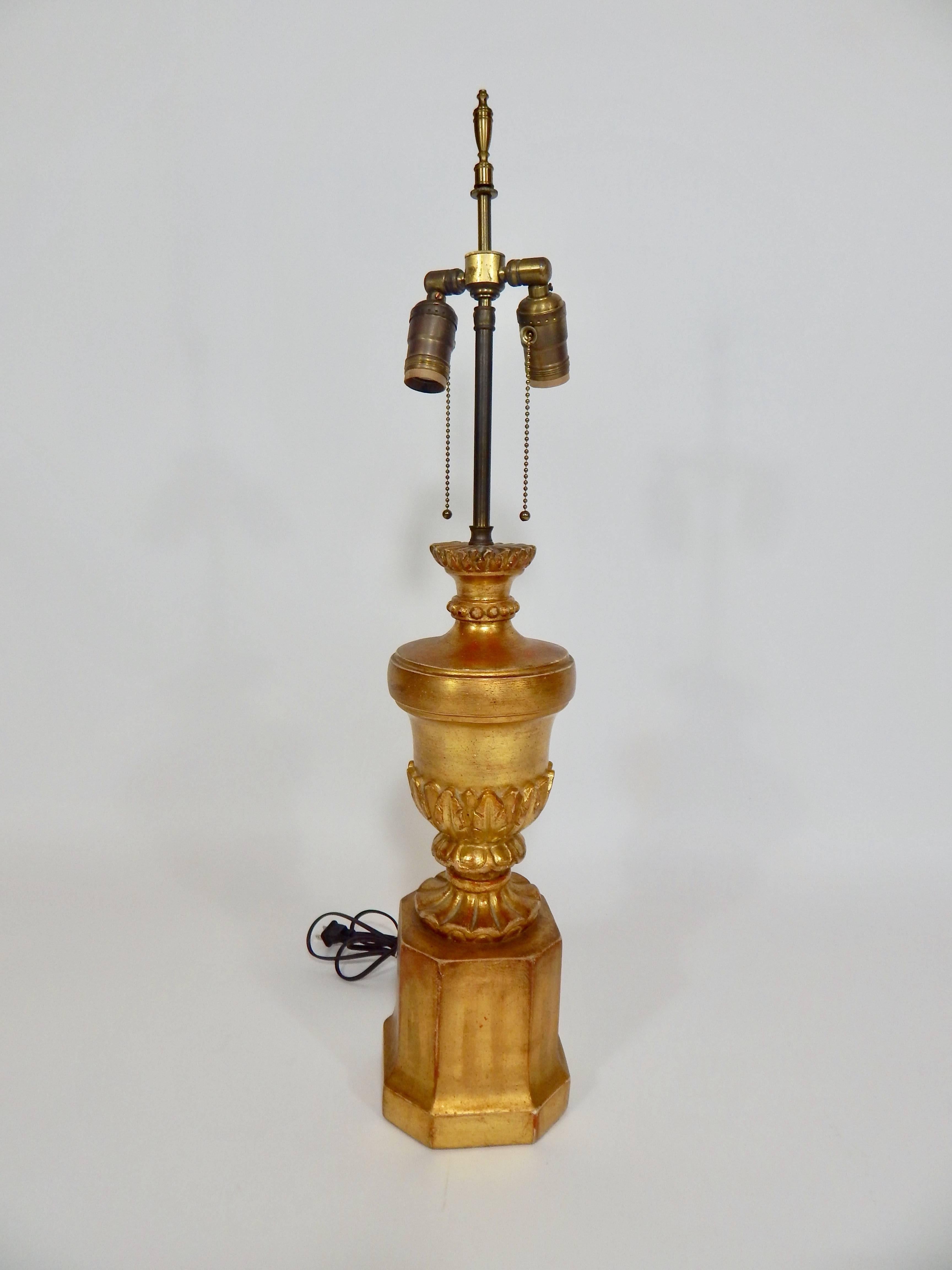 1950s-1960s borghese lamp. Original shade. Gilded base with brass hardware and finial. Two bulb sockets with individual on/off pulls.
Measures: Lamp height 30