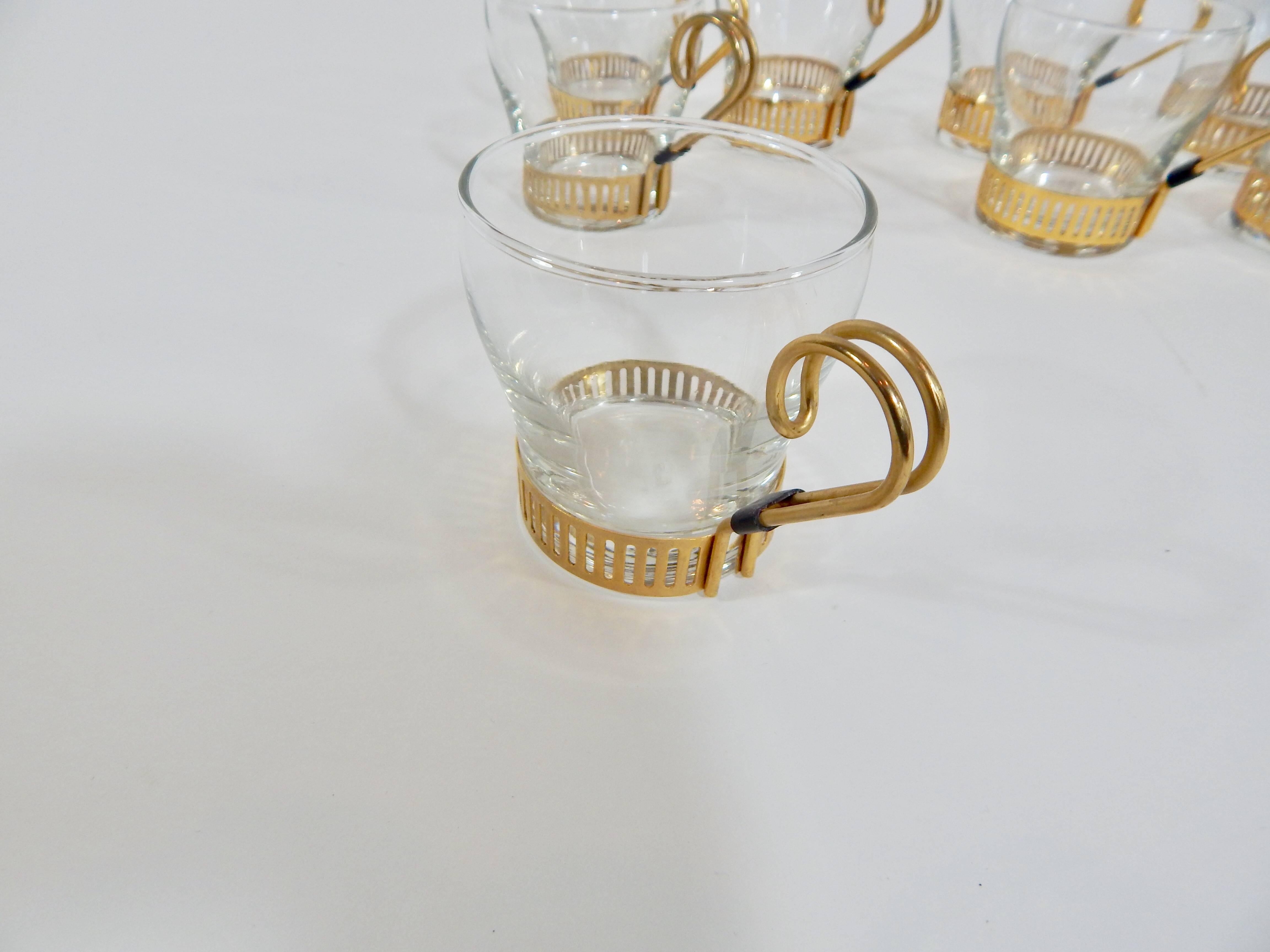 1960s glass cups with gold handles by Libbey Glass Company. 
Set of eight.
