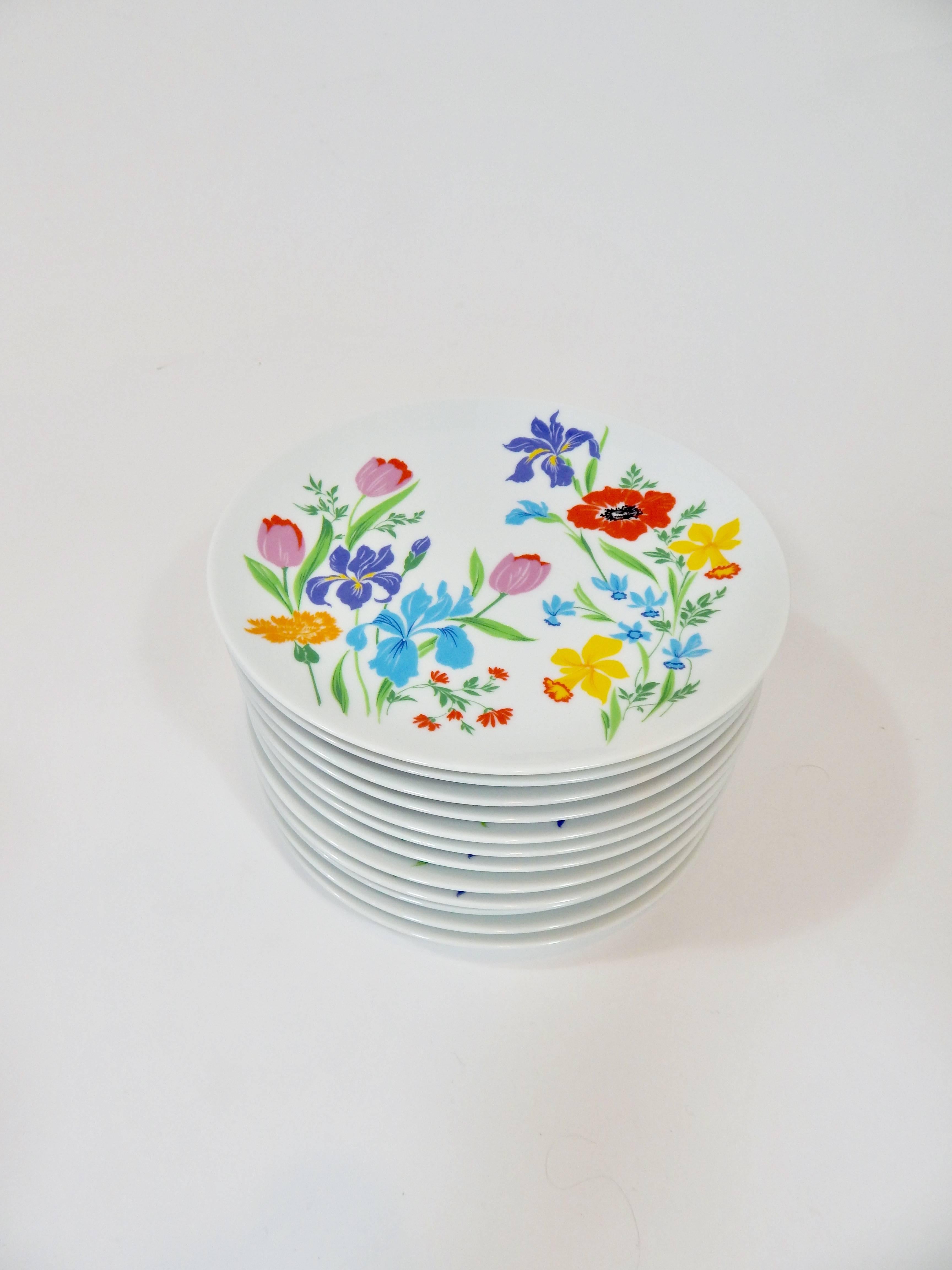 Set of 12 Porcelain 10 inch plates. Bright multicolored floral Primavera pattern. All plates are marked. Made by Heinrich Germany. Excellent Condition 