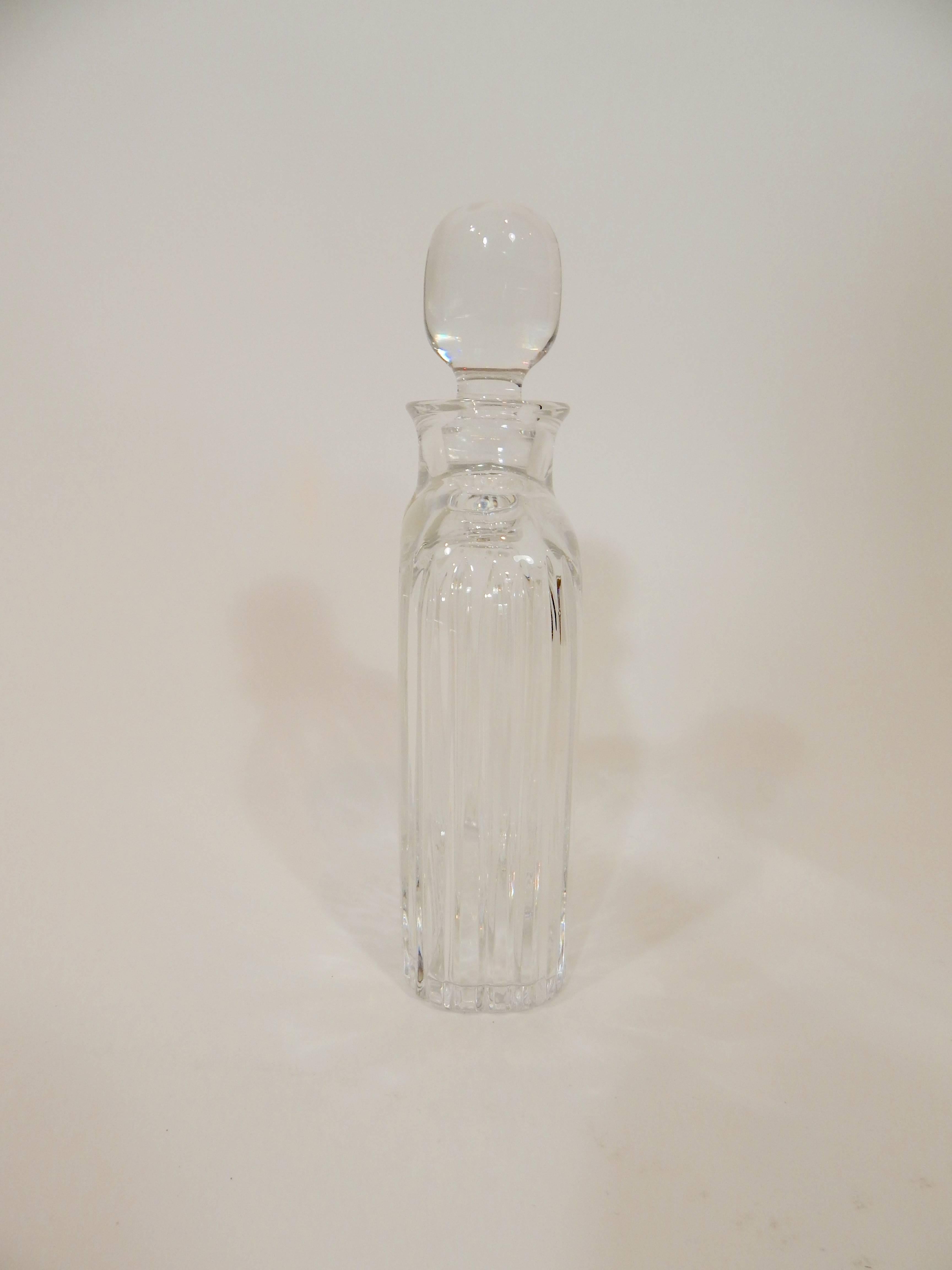Crystal decanter. Never used. Excellent condition. Still retains original stamp.
A vintage midcentury 1960s-1970s Atlantis Sonnet cut lead crystal whiskey decanter with sharply defined vertical cuts that brilliantly capture and refract light.