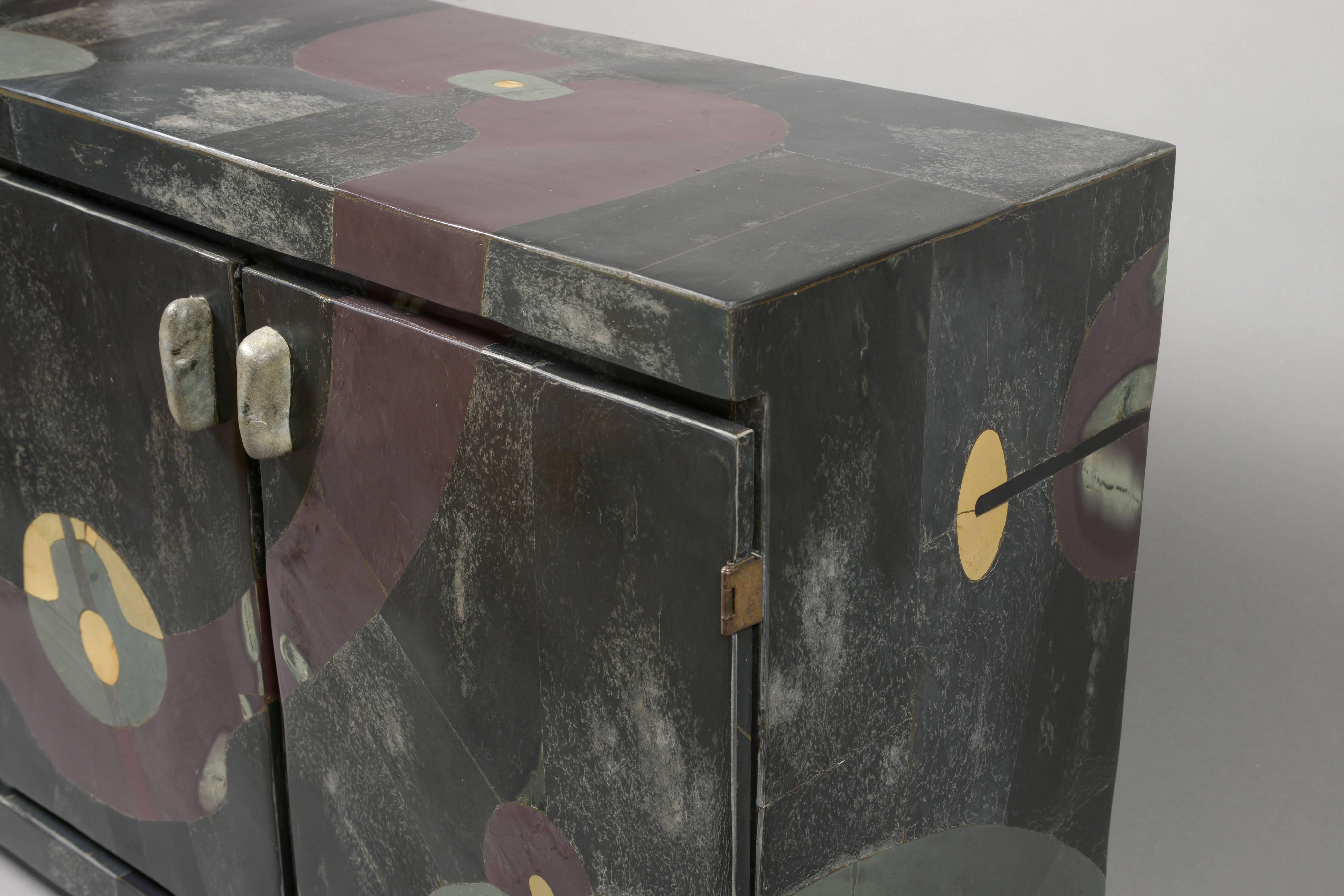 One of a kind slate marquetry three-doors sideboard.
Comlissoned in 1975.