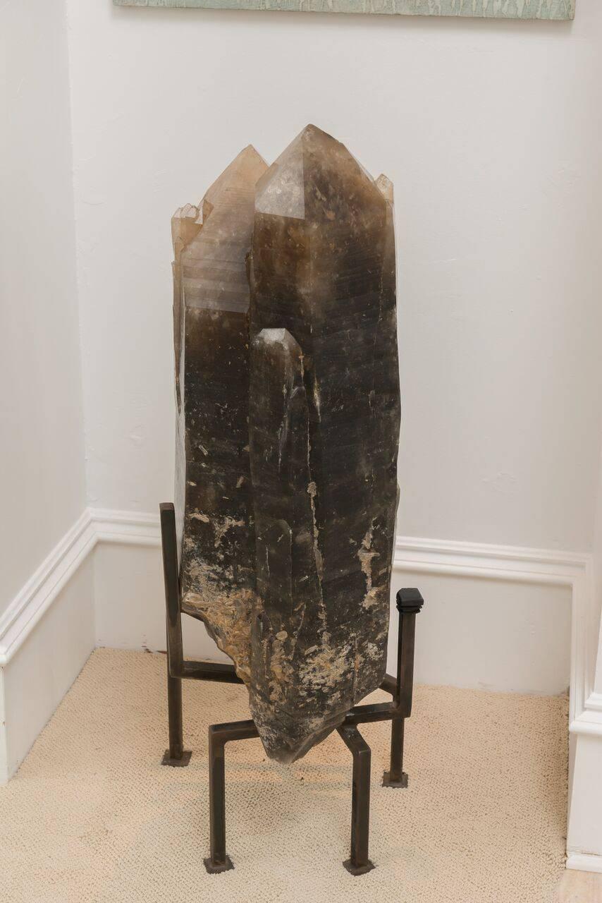 Alpine smoky quartz crystal fragment mounted on a modern, bronze metal base. 
Provenance: Mont Blanc Massif, France, probably obtained in the 1930s.
