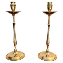 Quality pair of slender antique brass candlesticks