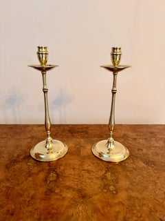 Quality pair of slender antique brass candlesticks