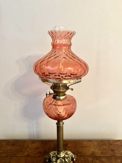 Fine quality antique Edwardian cranberry glass and brass oil lamp