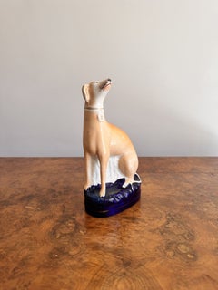Lovely antique Victorian Staffordshire seated greyhound