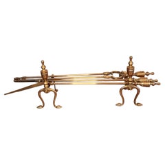 Fine quality antique Edwardian brass fire irons and fire dogs