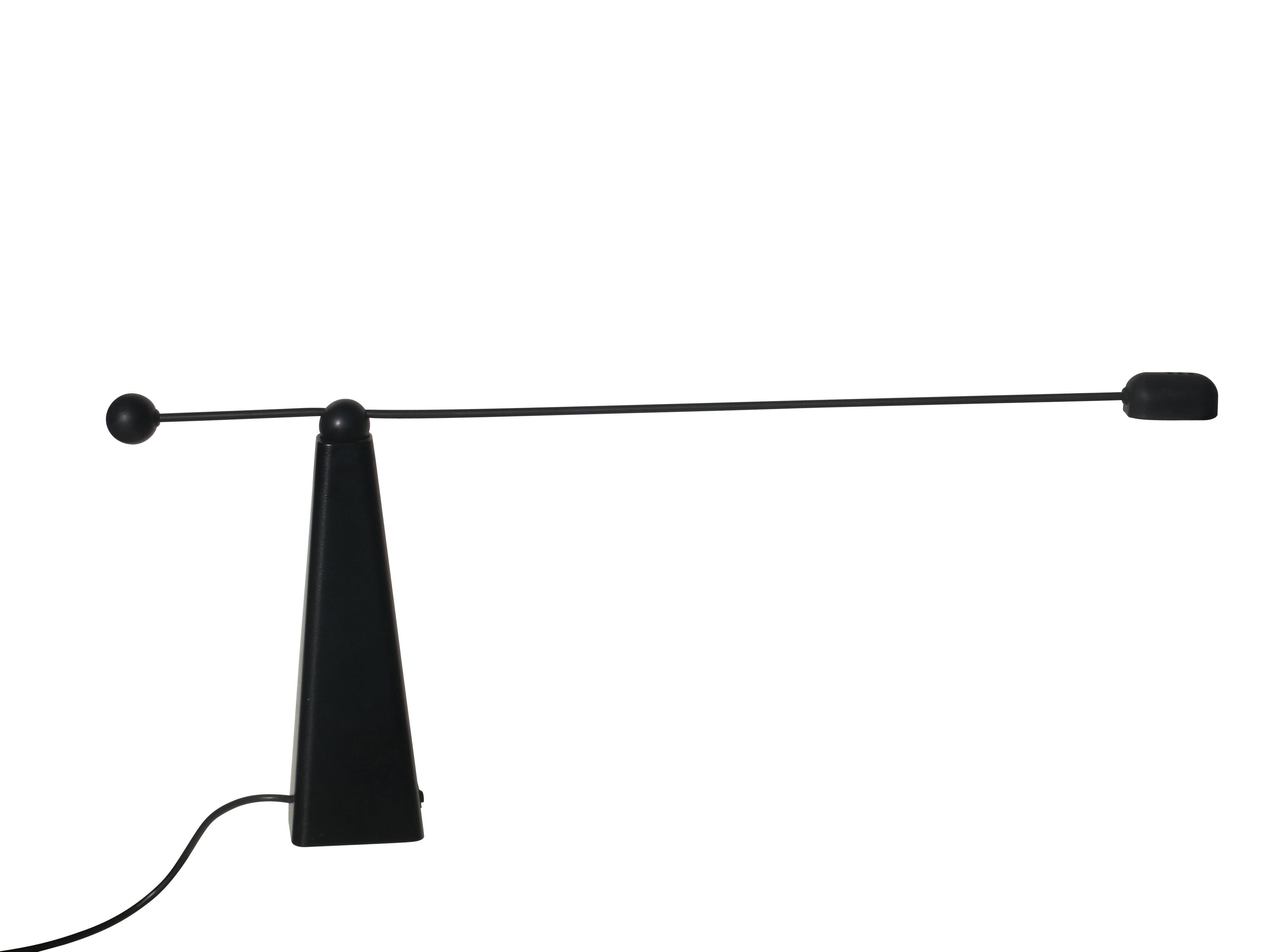 Stylish and sleek all black lamp designed by Ron Rezek. The arm manipulates side to side and up and down for task lighting or spotlighting of objects. The rocker switch has a high/low intensity option. The fixture takes a 12 volt, 50 watt bulb.