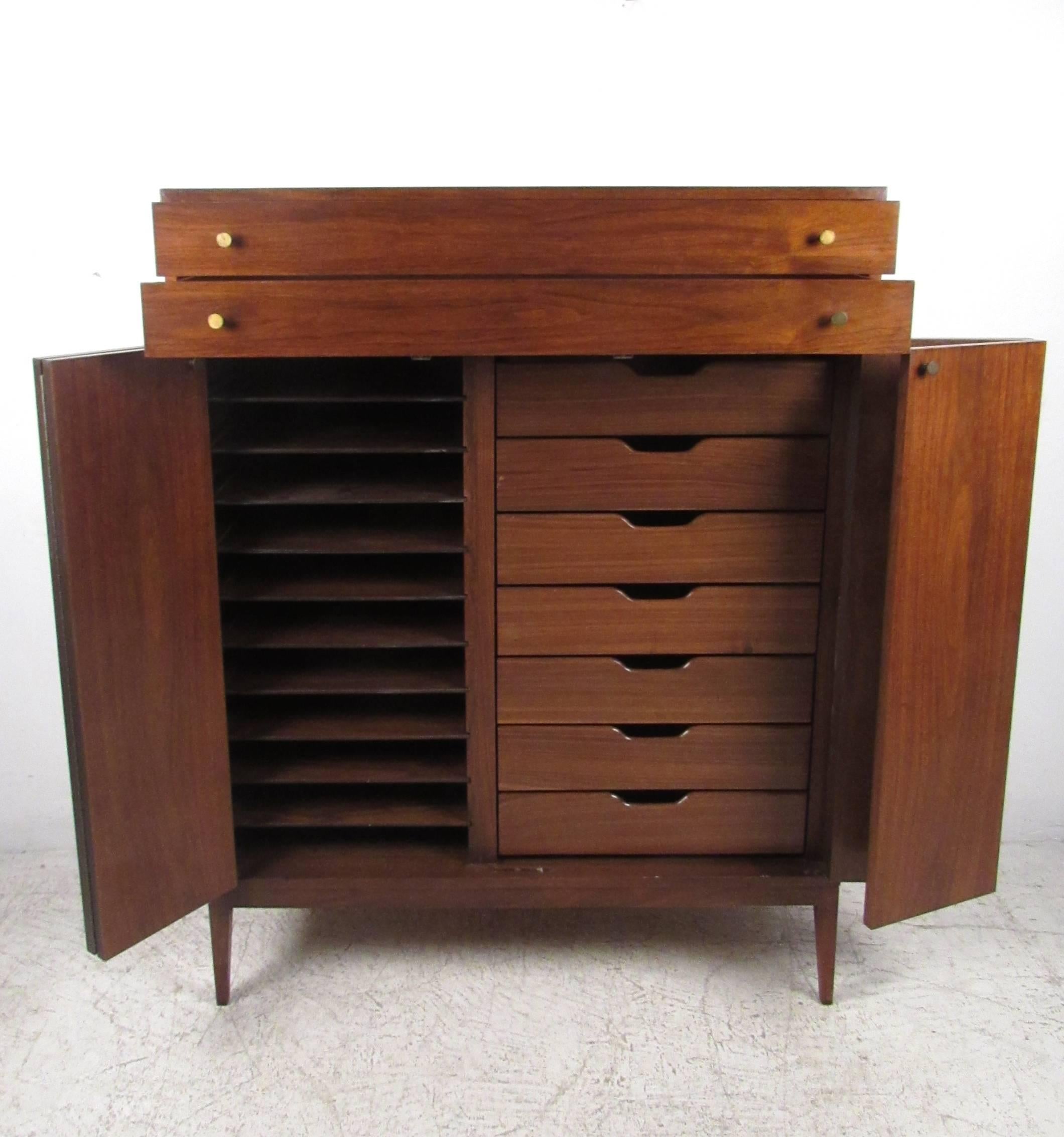 This exquisite vintage chest offers plenty of storage options, allowing for optimal organization. Unique tapered legs, vintage brass pulls and a fantastic original design make this a wonderful addition to any interior. Please confirm item location