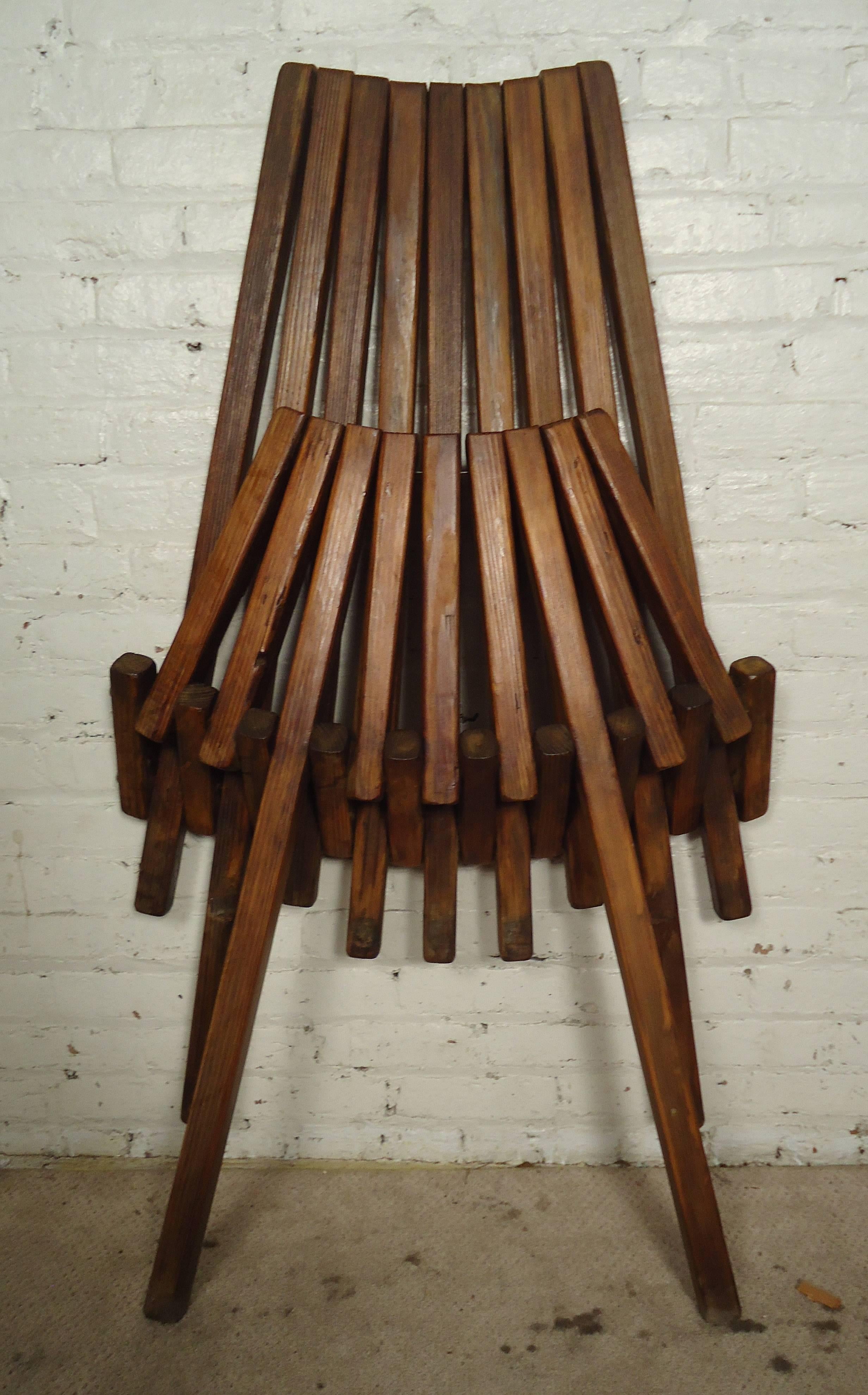 Vintage-modern indoor or outdoor slatted wooden chair, recently re-finished, folds conveniently for space saving.

Please confirm item location NY or NJ with dealer.