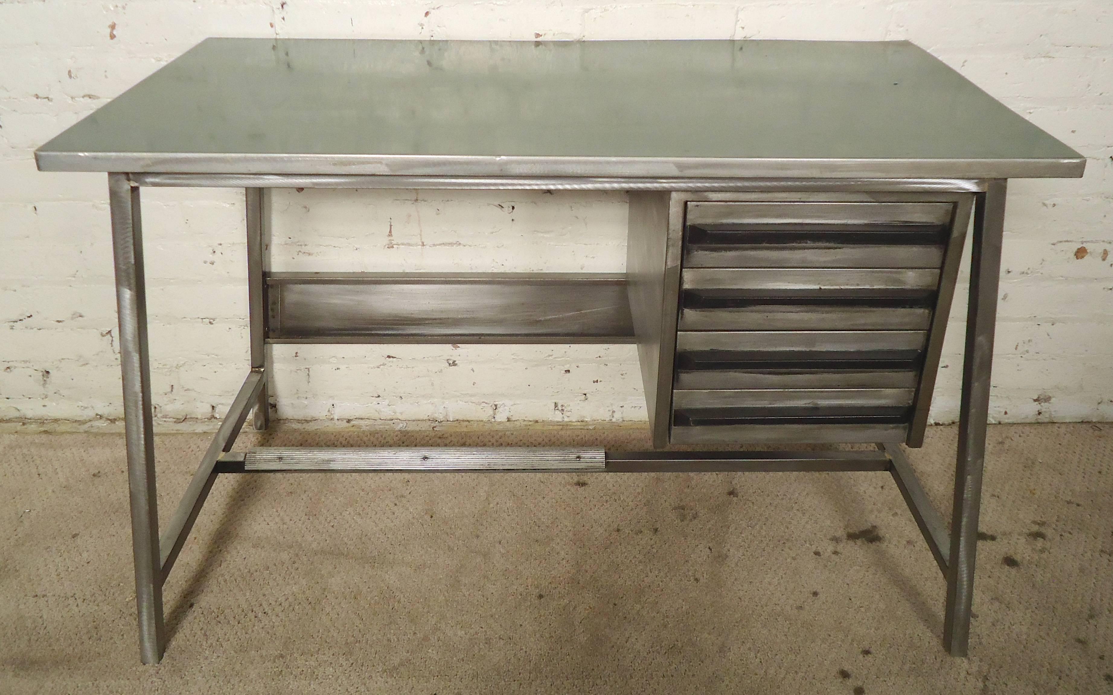 Mid-Century era work desk restored in a brush metal style. Green laminate top, four drawers and foot rest. Simple and attractive for home or office.
Measures: Kneehole: 21 W, 17 D, 24 H.

(Please confirm item location - NY or NJ - with dealer).
 