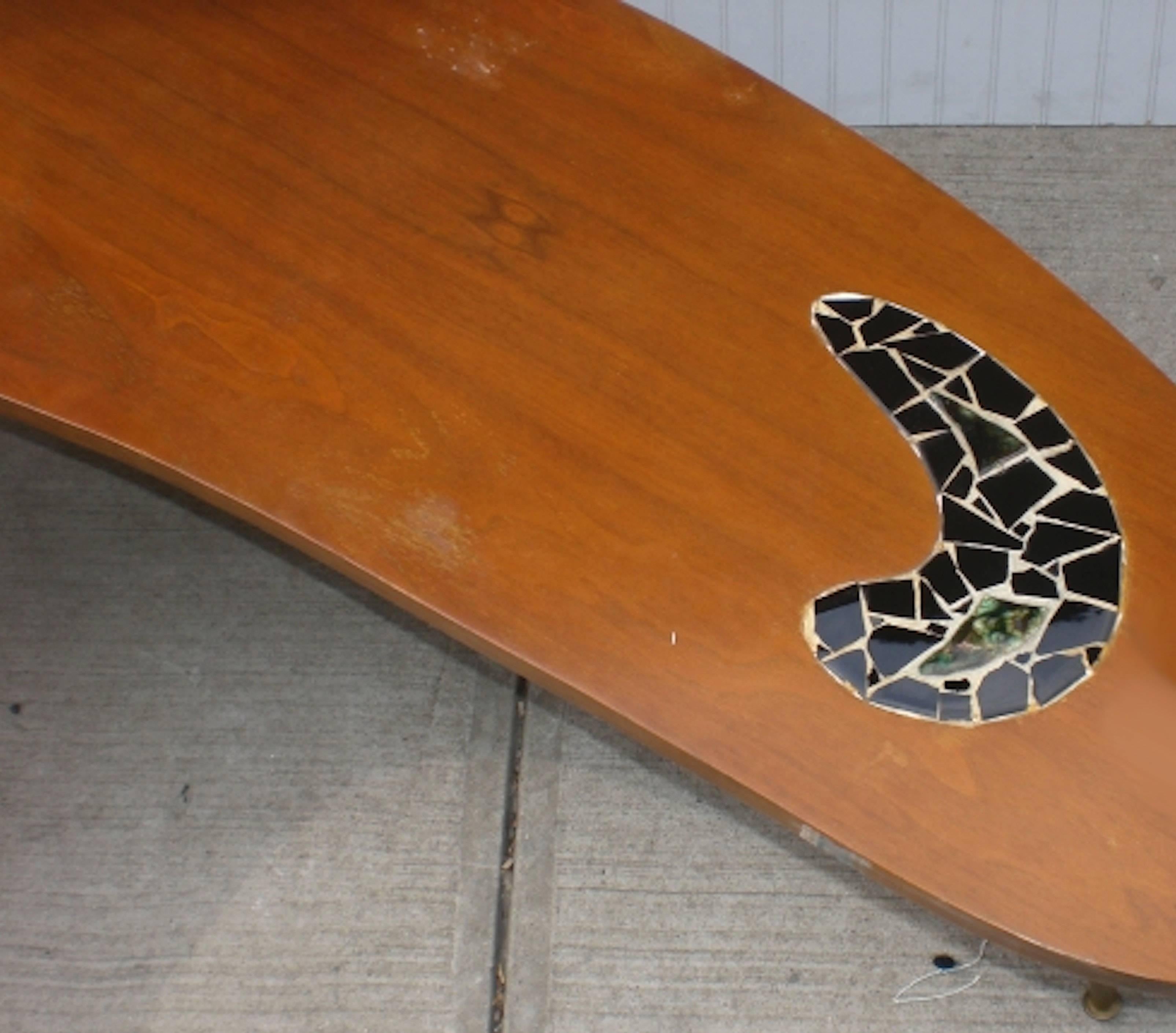Mid-Century Modern table with an exaggerated kidney shape. Features mosaic tile patterns.

(Please confirm item location - NY or NJ - with dealer).
 