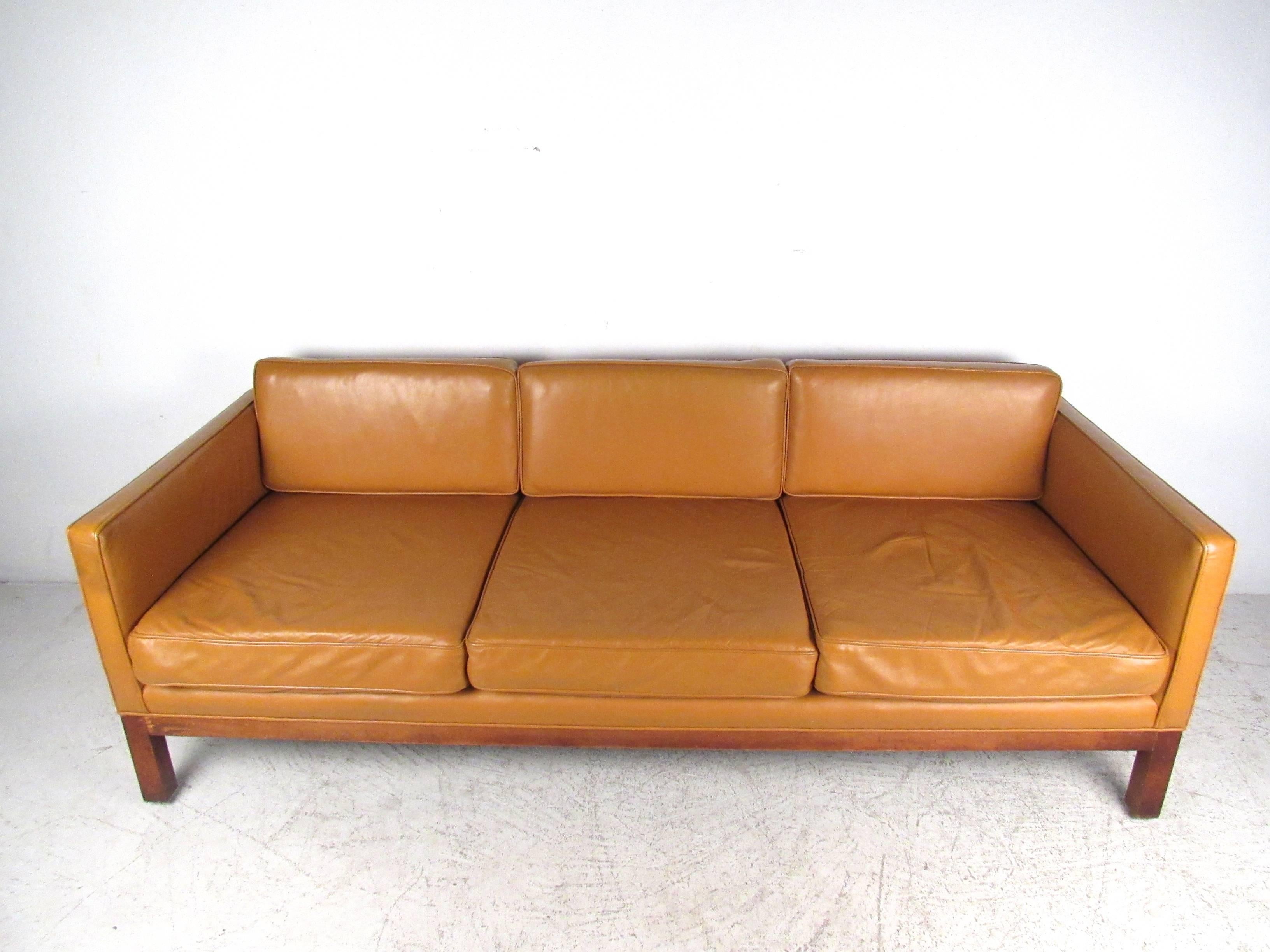 This beautiful vintage sofa offers a wonderful mix of modern style and timeless comfort. With Børge Mogensen style design, hardwood frame and spacious seating for any interior, this Mid-Century couch is the perfect solution for home or business.