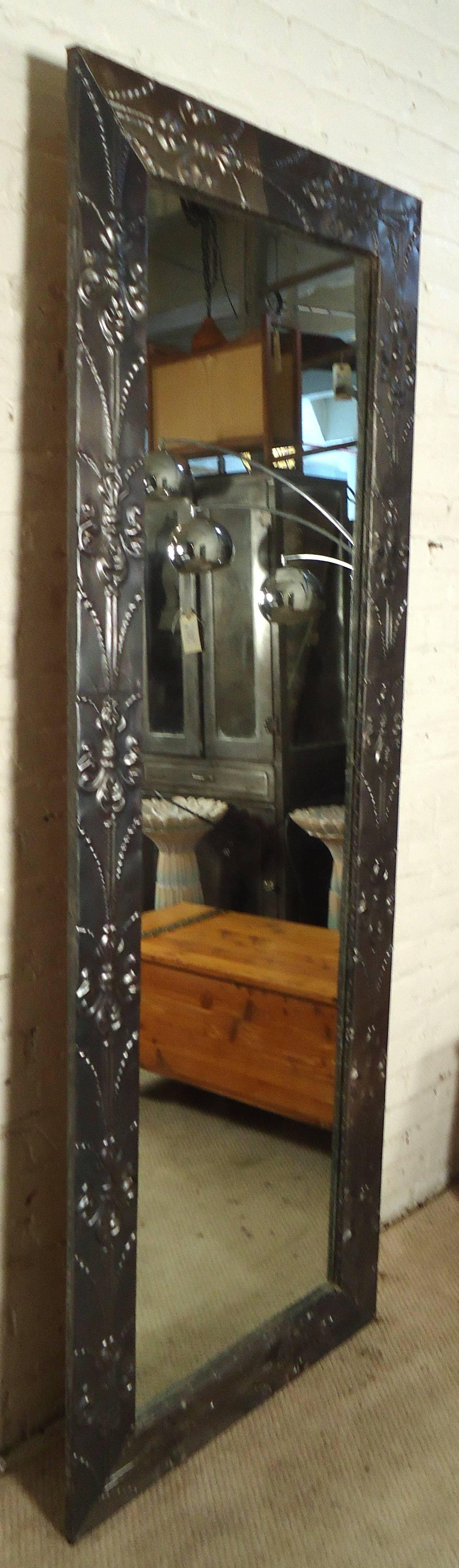Vintage-modern mirror featuring sculpted metal frame with fluer-de-lis design sculpting. 

Please confirm item location NY or NJ with dealer.
