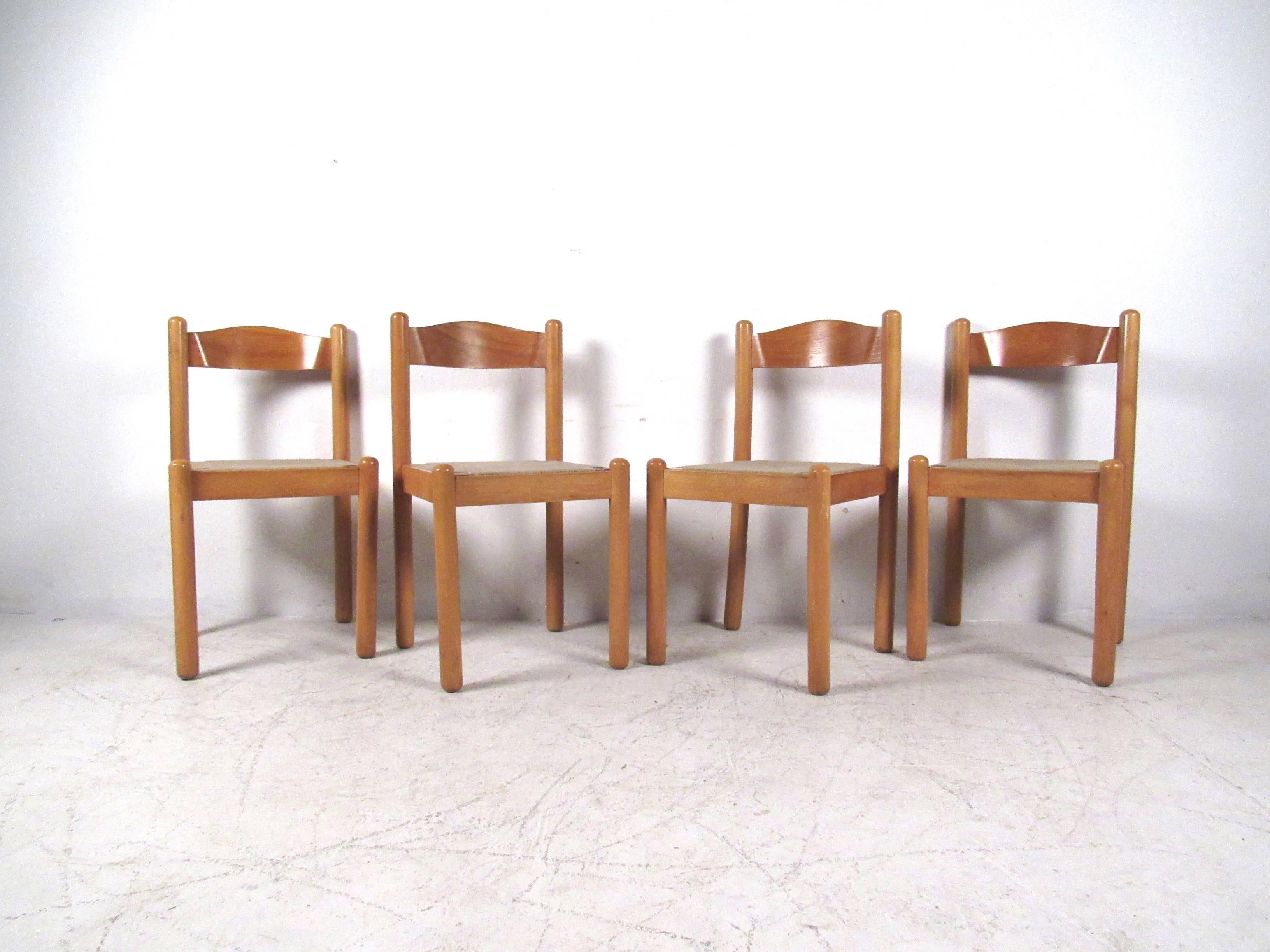 Beautiful set of four Italian modern dining chairs features rush seats and curved backs. Unique chairs for any setting, please confirm item location (NY or NJ).