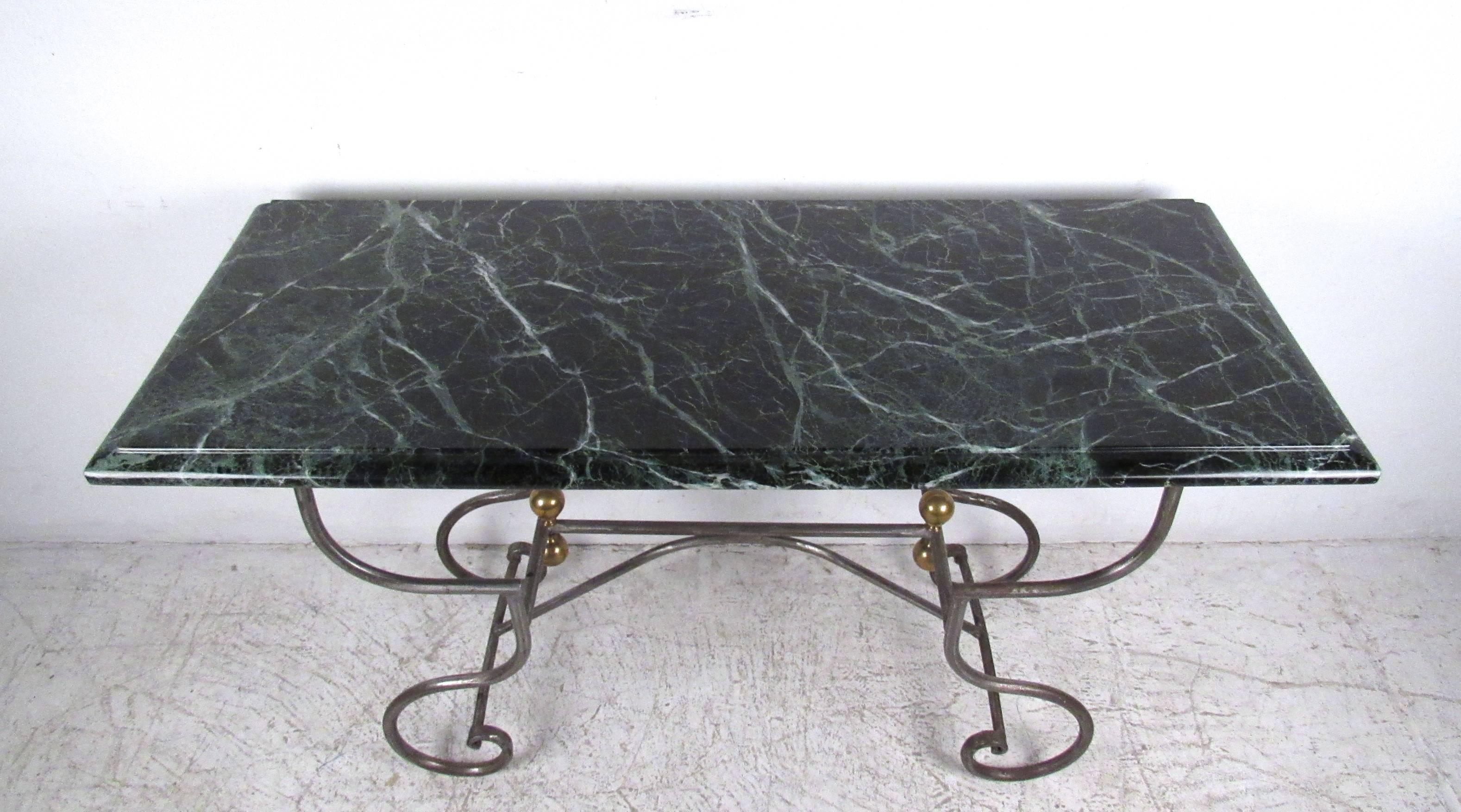 This stunning iron and brass base console table with exquisite marble top makes a stylish addition to any hall or room. Unique mix of materials and the rich color profile of the marble add to the charm of the piece. Please confirm item location (NY