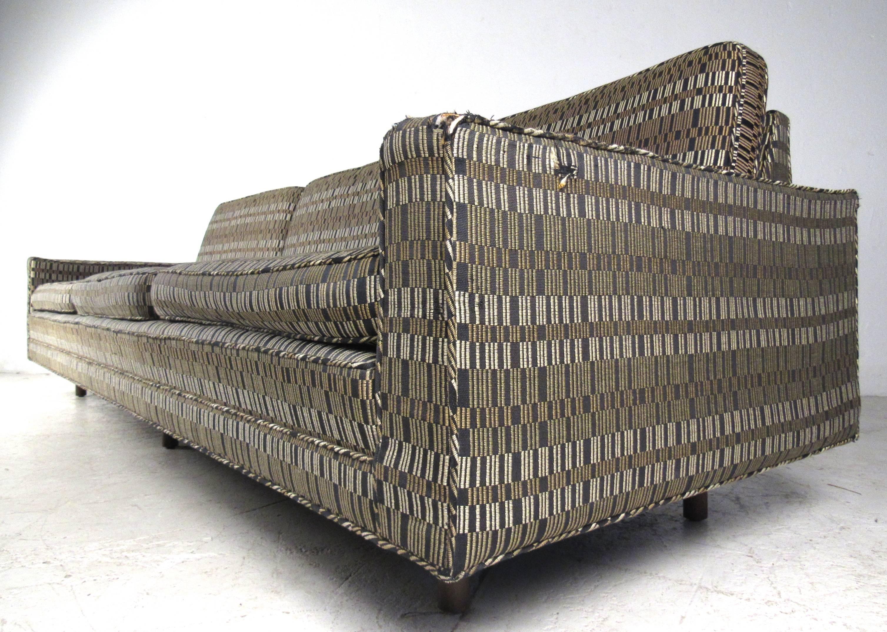 This gorgeous oversized sofa by Harvey Probber offers a stylish and comfortable seating option for any interior. Vintage fabric, quality six leg construction, and unique low profile design add to it's Mid-Century charm. Please confirm item location