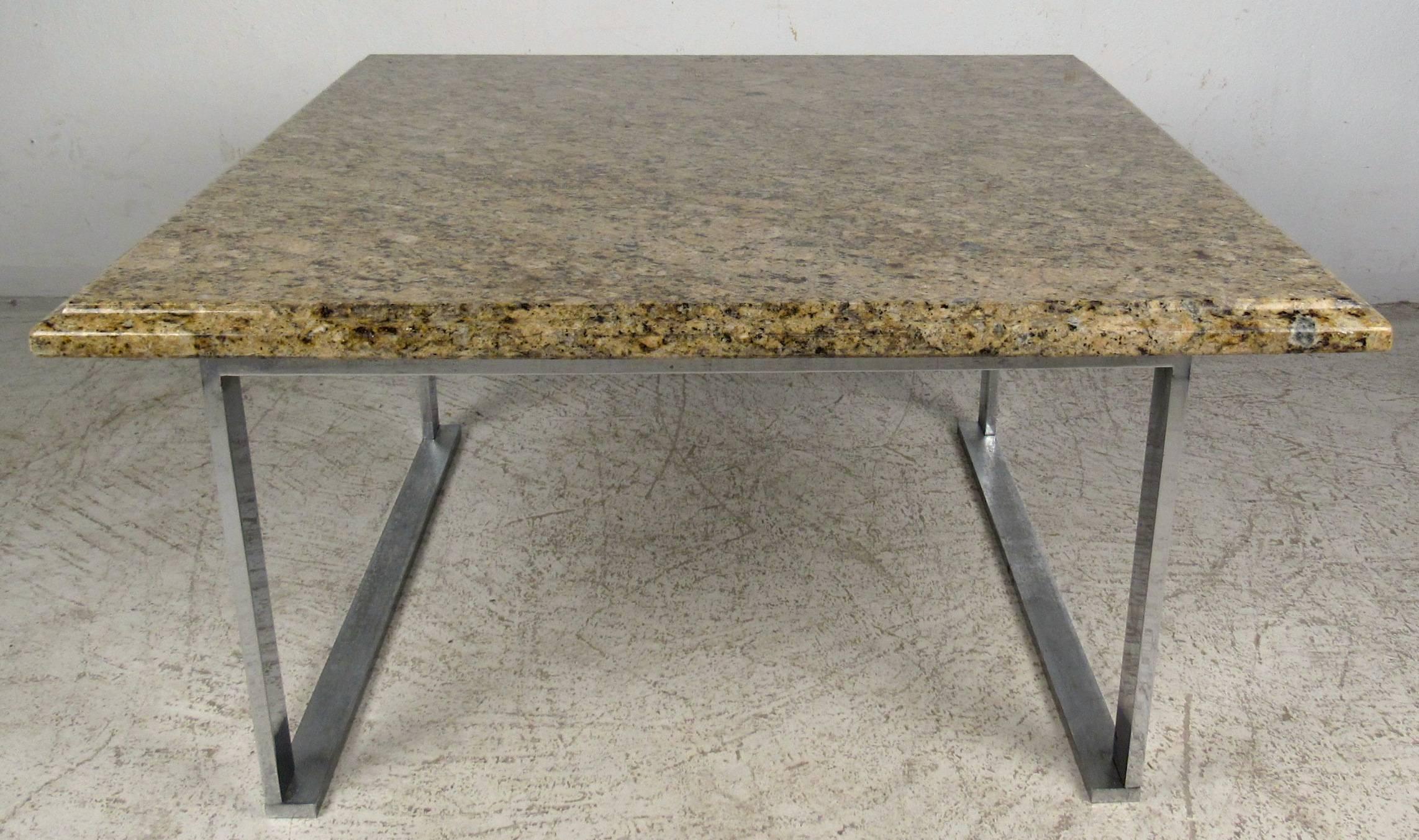 Vintage modern coffee table featuring beautiful marble top with sculpted chrome legs, designed in the manner of Milo Baughman.

Please confirm item location NY or NJ with dealer.