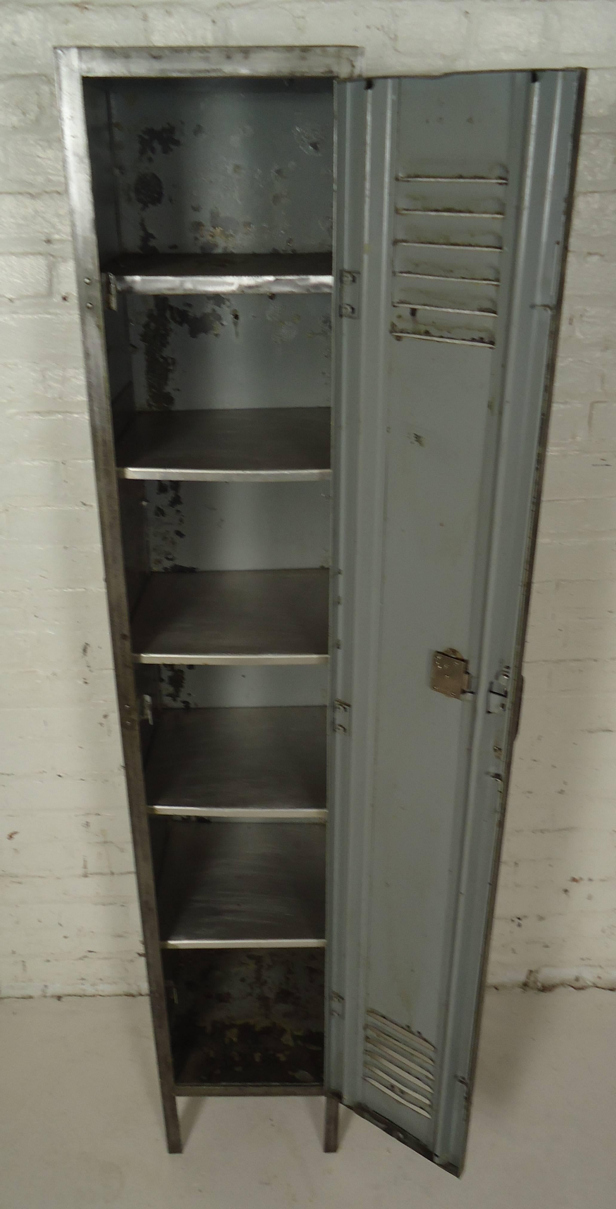 Vintage-Industrial locker unit featuring one door and a six metal shelf interior.

Please confirm item location NY or NJ with dealer.