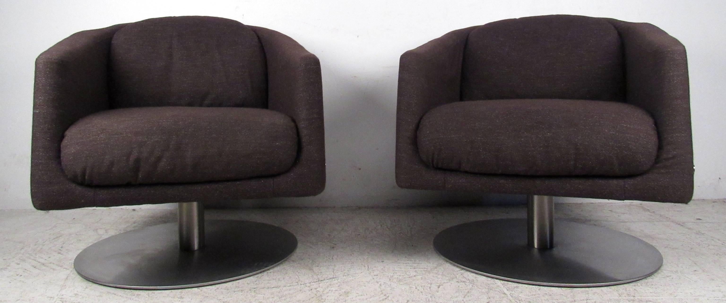 Two vintage-modern Italian swivel chairs by Natuzzi, featuring solid metal base with full swivel. 

Please confirm item location NY or NJ with dealer.