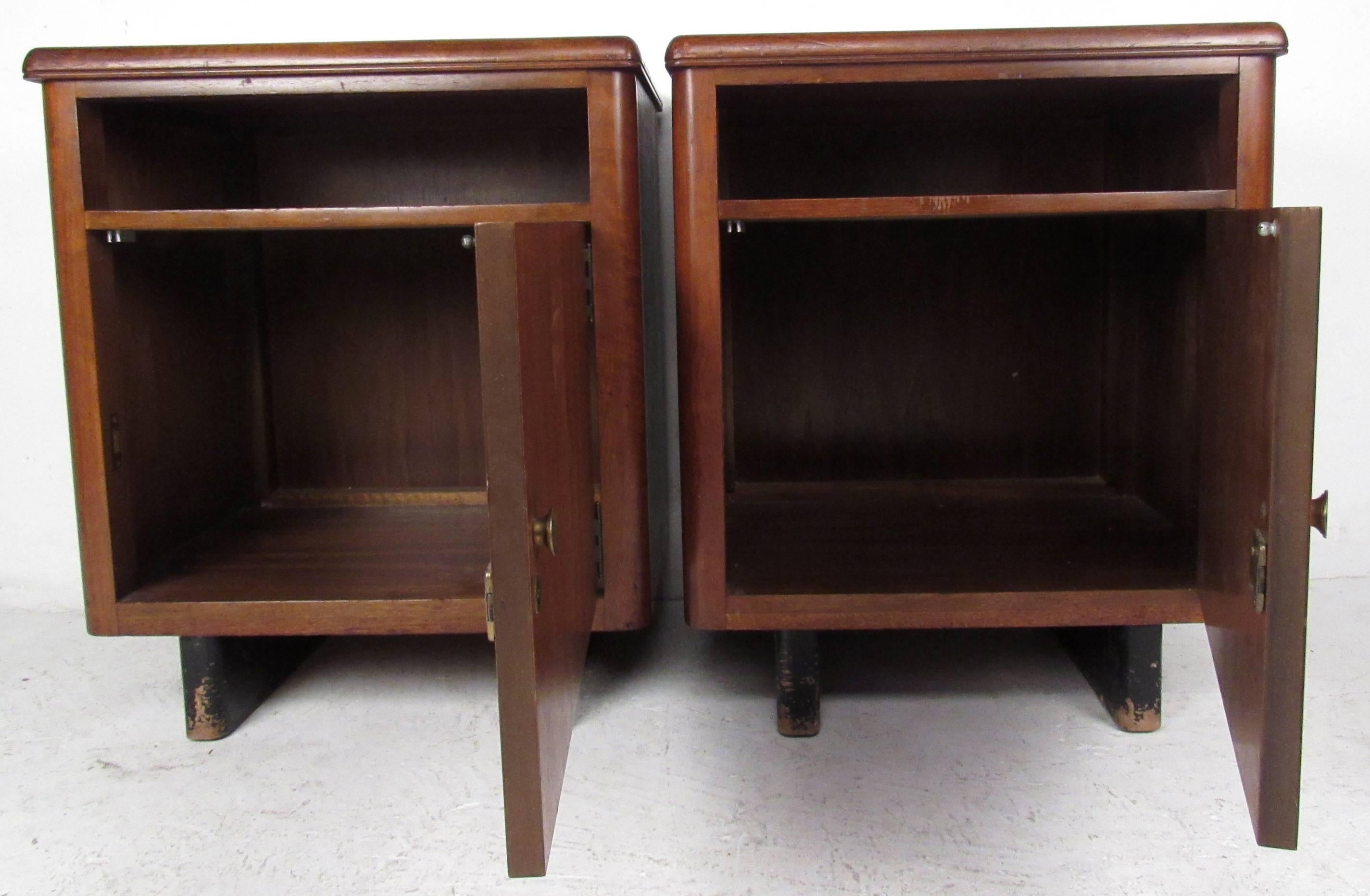 This unique pair of vintage nightstands combine open spacious storage with mid-century style. Perfect height for bedside tables, the combination of open shelf and cabinet space make these a versatile addition to any setting. Stylish sled legs and
