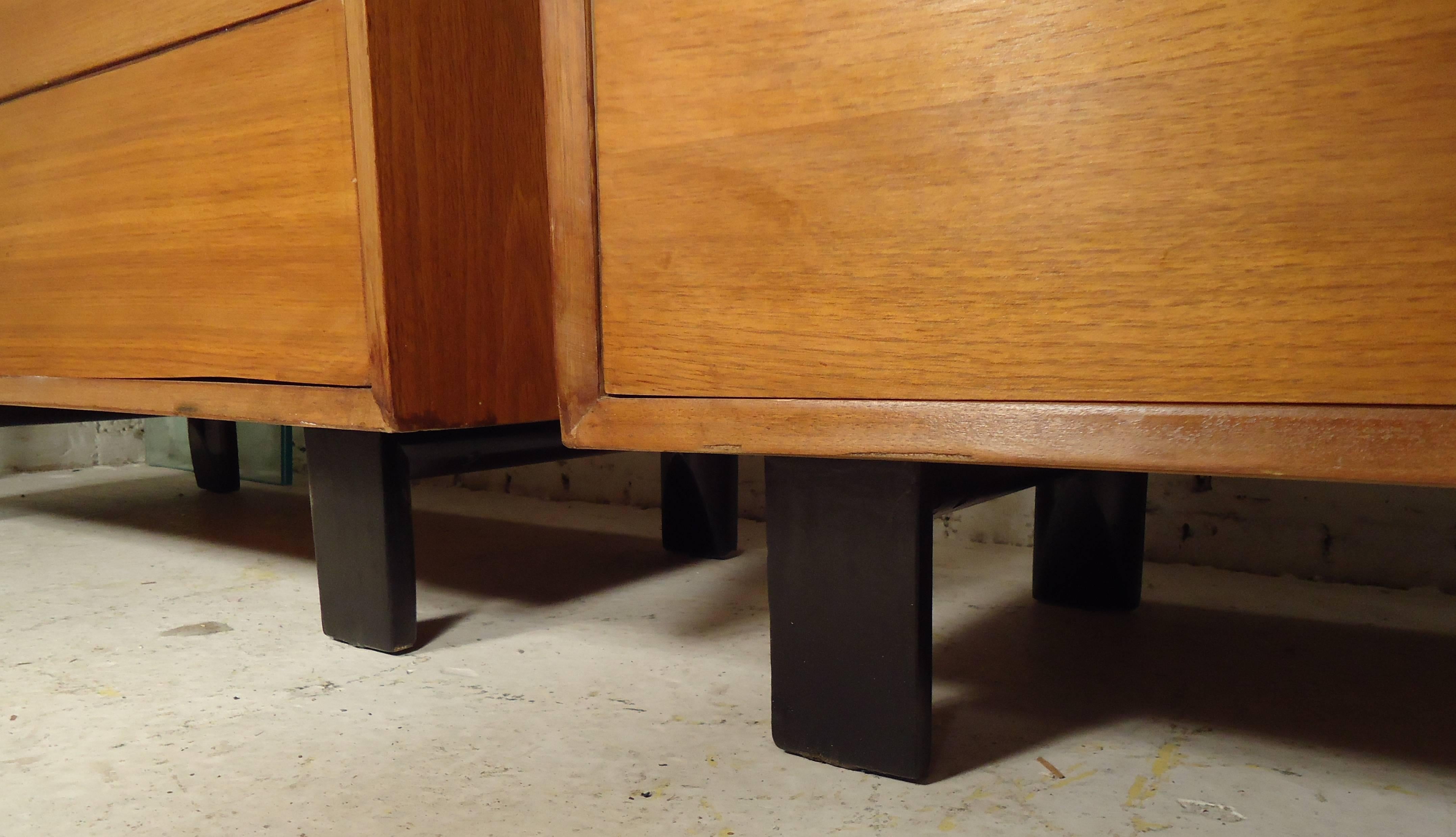 Two vintage-modern five-drawer dressers featuring sculpted chrome handles, designed by George Nelson for Herman Miller.

Please confirm item location NY or NJ with dealer.