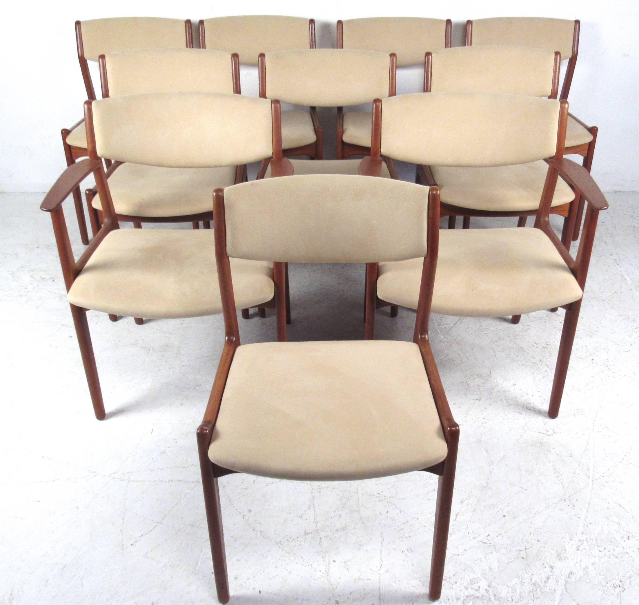 This beautiful set of ten matching dining chairs by Soro Stole pairs perfectly with this large draw leaf table by Skovby. Wonderful vintage finish, comfortable upholstery and beautiful tapered legs add to the Mid-Century charm of the set.