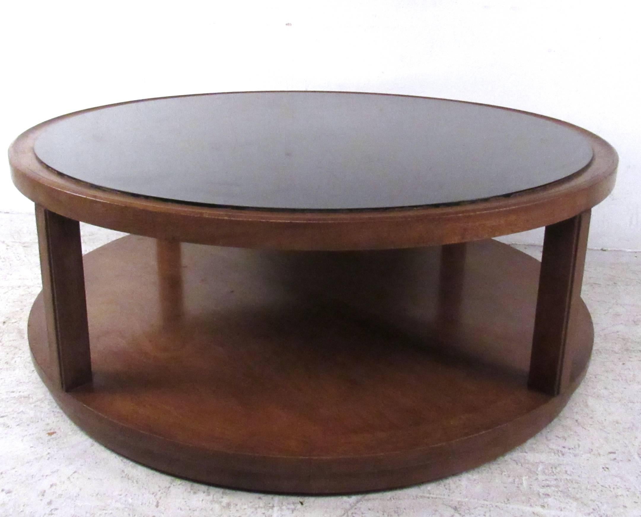 This formica style top coffee table features unique two-tier construction, with a modern style hardwood base on glides for ease of movement. Manufactured by Dunbar this wonderful center table works great in any seating area, please confirm item