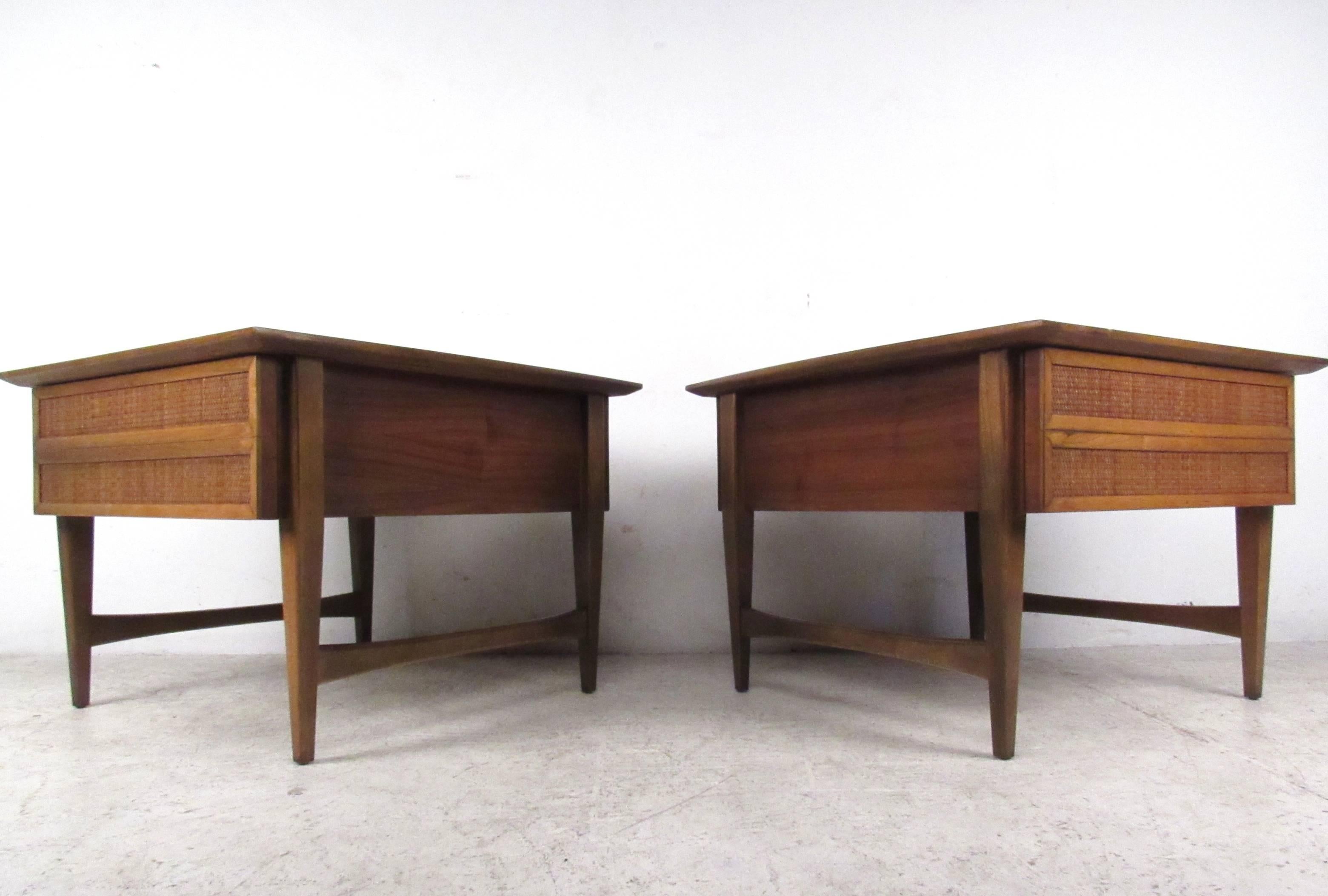 This vintage pair of cane front end tables by Lane Furniture offer spacious storage, stylish tapered legs and a unique Mid-Century aesthetic. Perfect side tables for any interior; please confirm item location (NY or NJ).