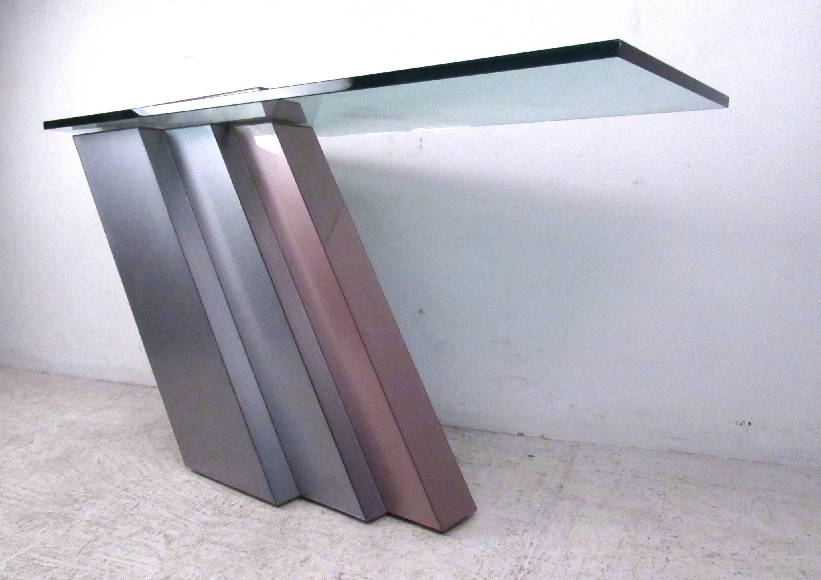 This vintage cantilever table features a sturdy weighted base that features unique lines and a thick glass top. Fantastic retro style for any hallway, entryway, or living room. Please confirm item location (NY or NJ).
