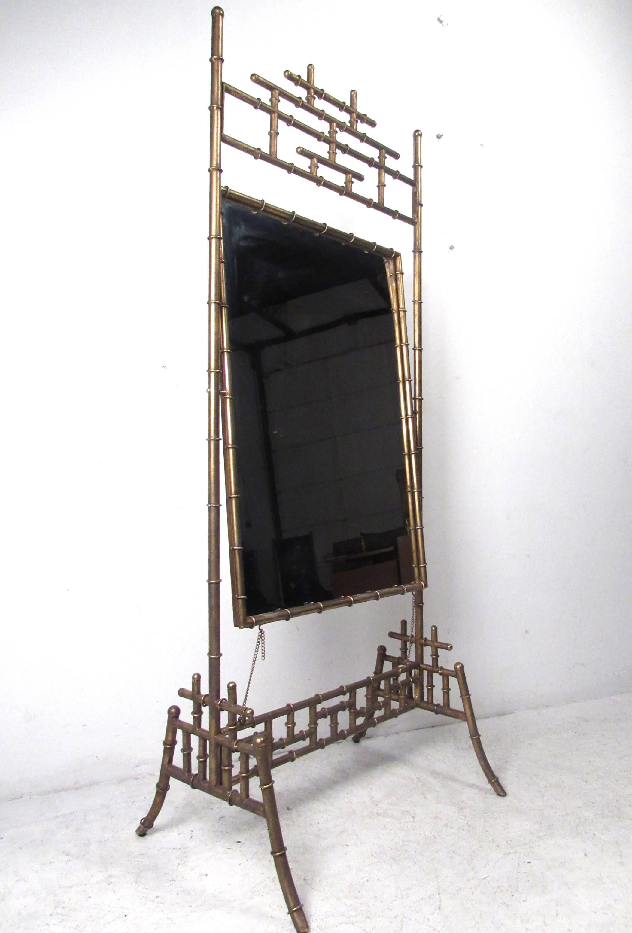 This unique vintage mirror features a stylish Asian motif, gold leaf finish, faux bamboo frame, and pivots neatly in it's sturdy four leg frame. Perfect mirror for bedroom, dressing room, or business decor. Please confirm item location, NY or NJ.