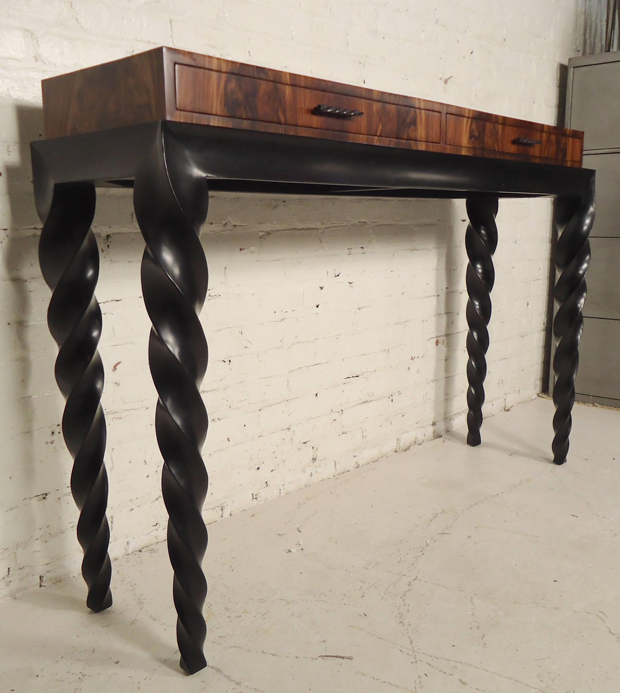 Fantastic console with brilliant bookmatched walnut and black twisted legs. Accenting twisted hardware, two drawers. Makes a great entryway table.

(Please confirm item location - NY or NJ - with dealer).
 