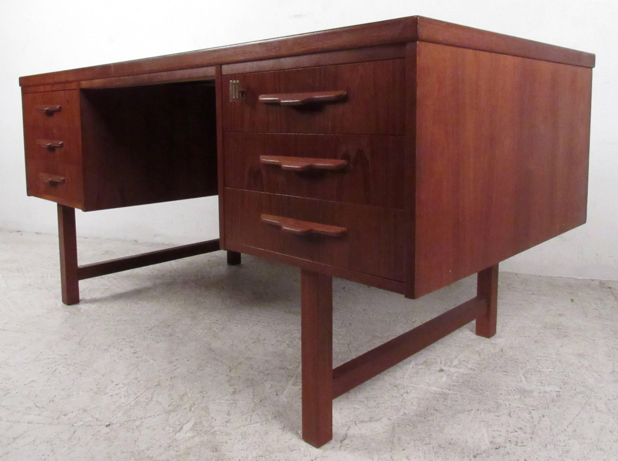 Vintage Danish Modern finished back desk featuring sculpted handles and rich teak wood grain throughout.

Please confirm item location NY or NJ with dealer.