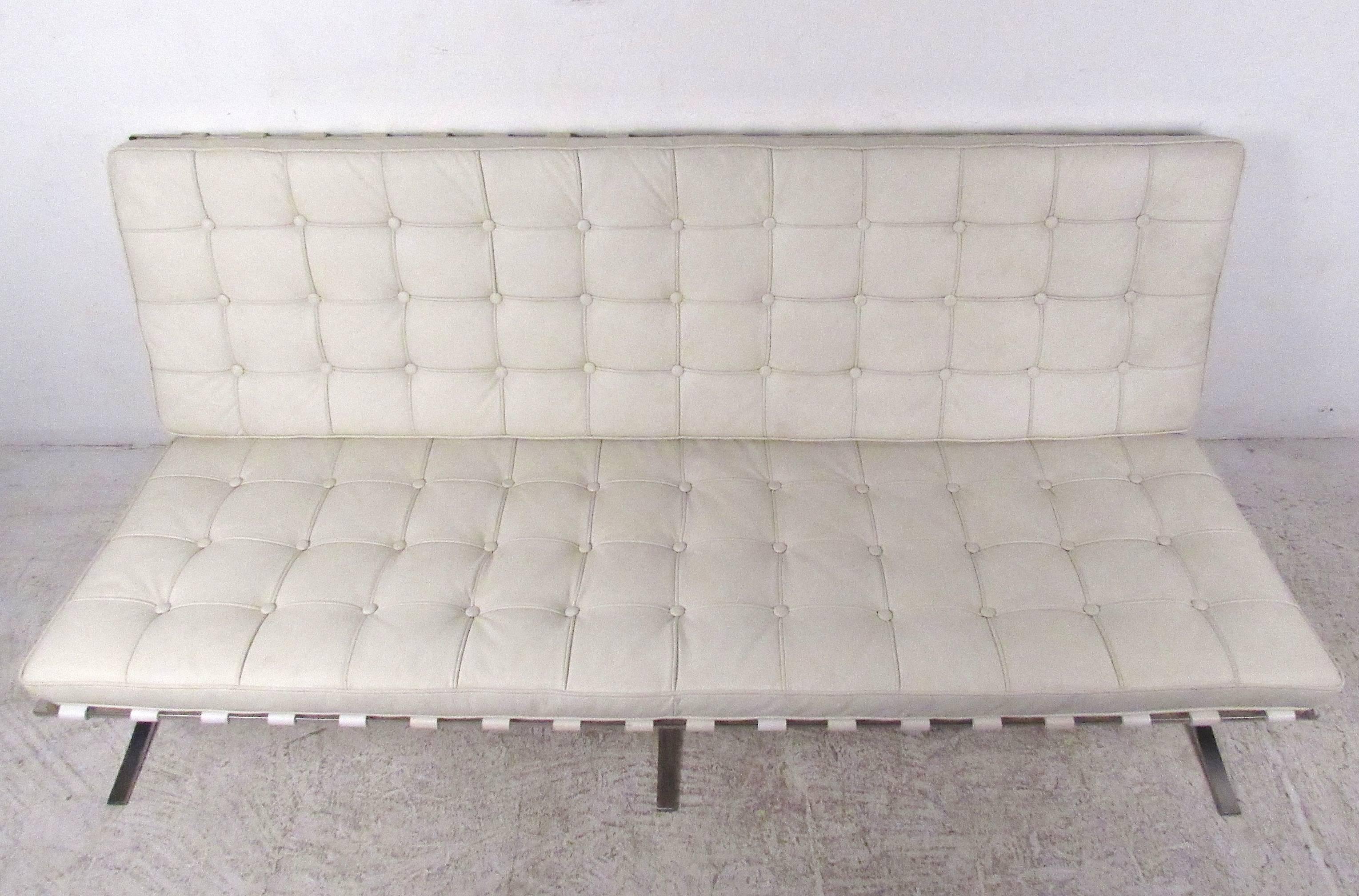 This tufted white leather sofa in the style of Ludwig Mies van der Rohe makes a stylish addition to any interior. Clean lines, unique chrome base, and comfortable leather upholstery make this great for business or home. Please confirm item location