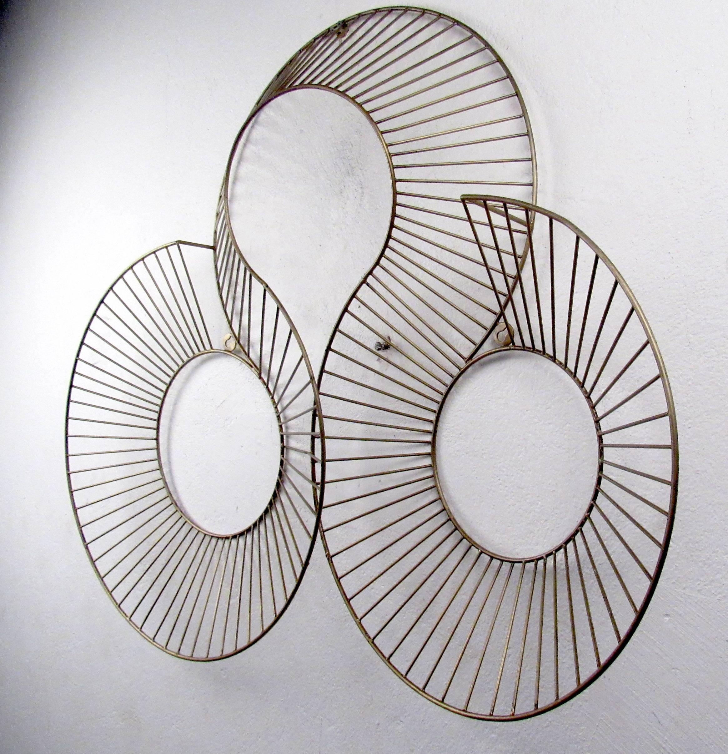 Vintage modern wall art featuring sculpted brass concentric circles.

Please confirm item location NY or NJ with dealer.