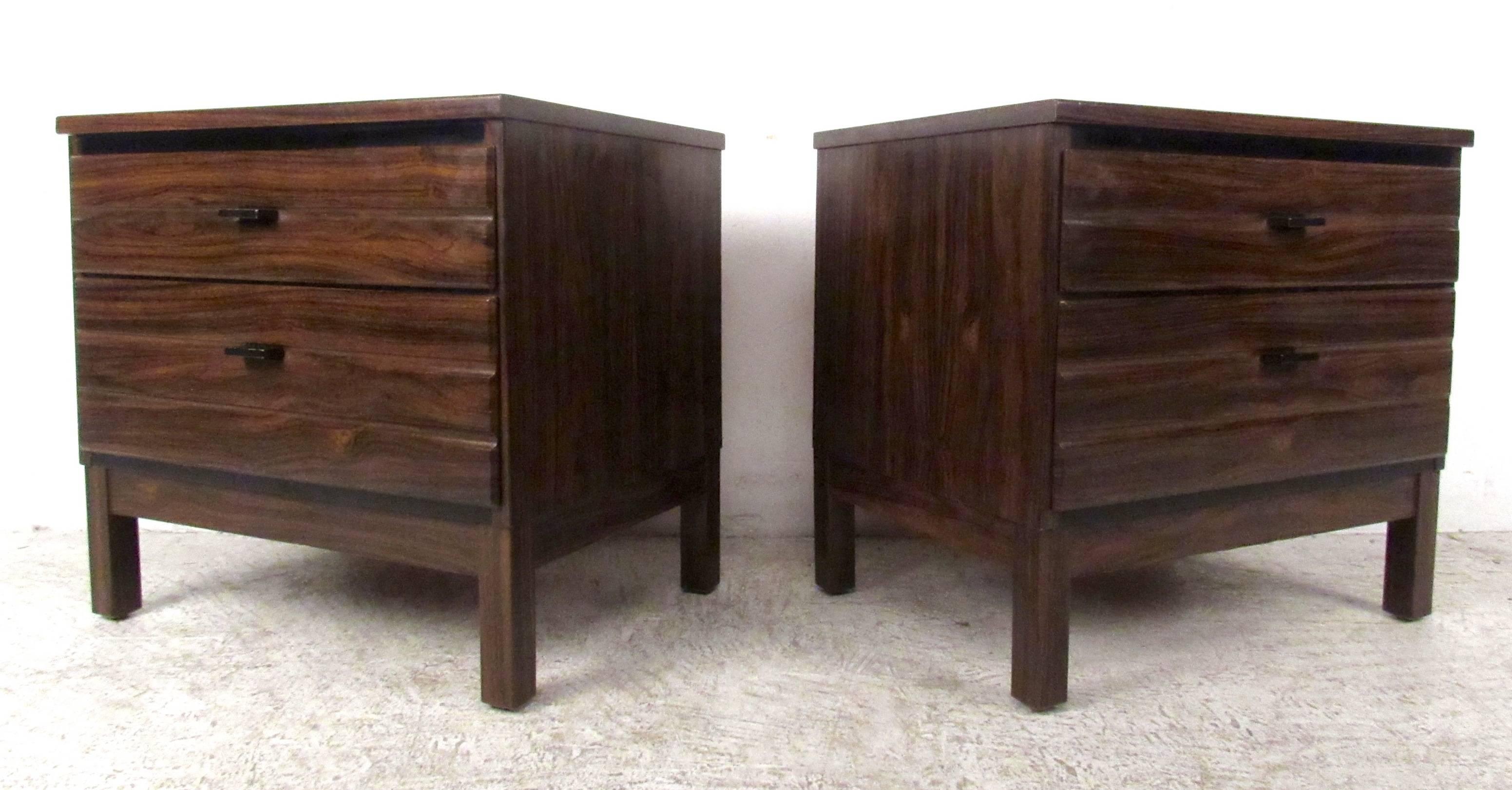 Two vintage-modern nightstands featuring two drawers each and beautiful rosewood grain, manufactured by American of Martinsville. Ideal pair of bedside end tables perfect for bedroom storage. 

Please confirm item location NY or NJ with dealer.