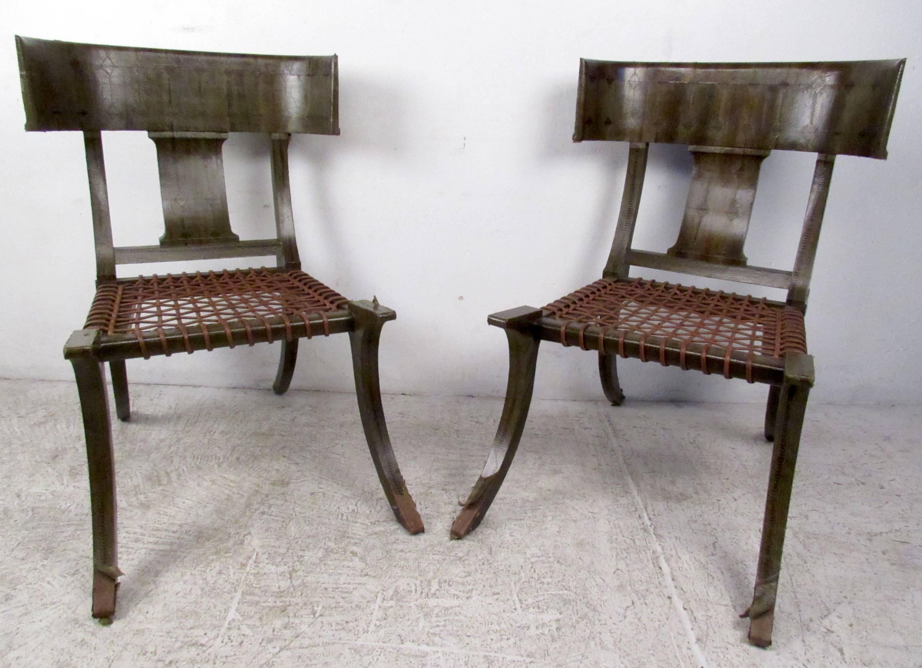 Two vintage-modern chairs featuring beautifully sculpted bodies with snake skin finish. Impressive matched pair of vintage Klismos chairs feature the mid-century style of Robsjohn-Gibbings, and make a memorable addition to any interior.

Please