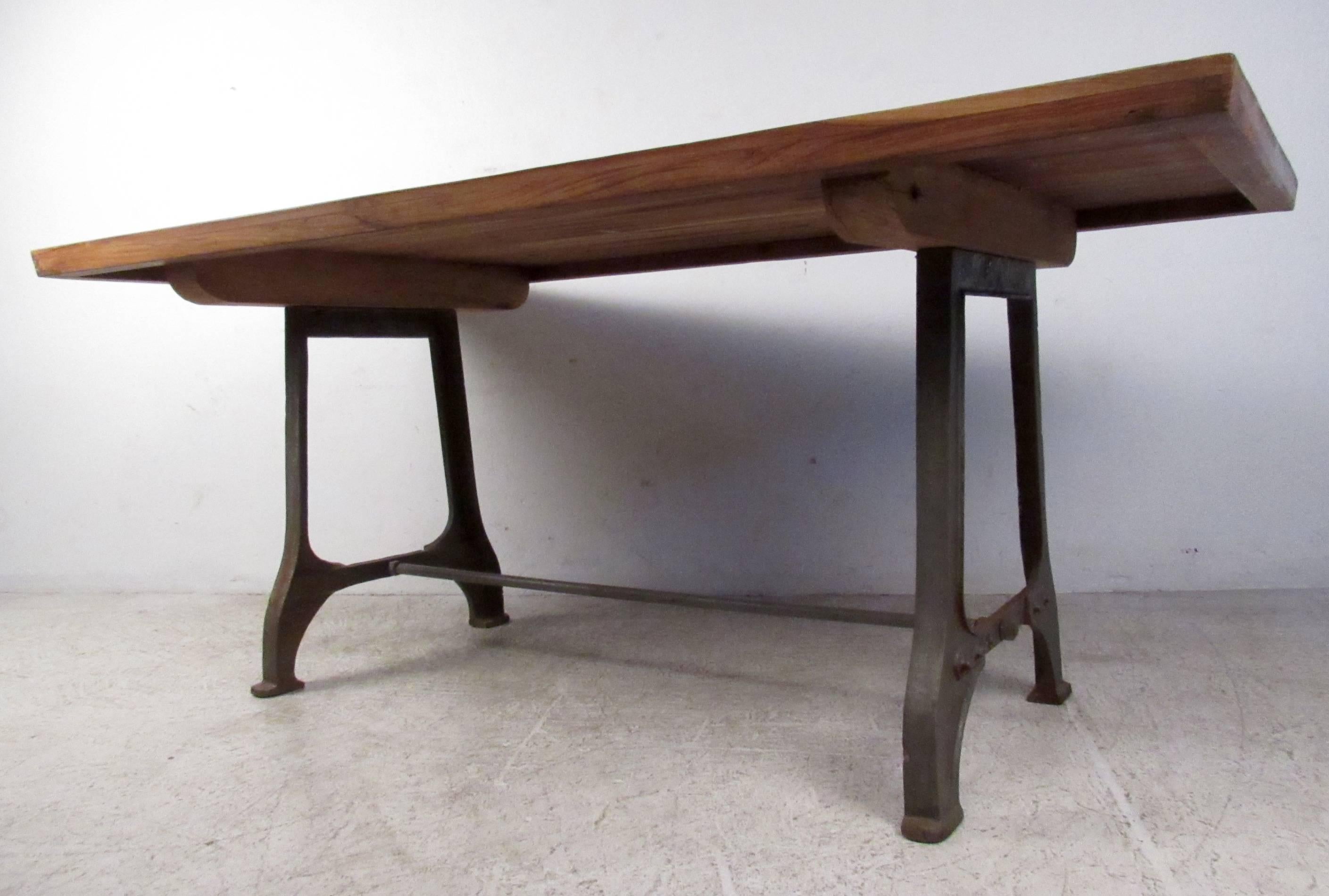 Vintage-modern dining table featuring heavy Industrial iron base and beautiful rosewood top makes a striking dining room or kitchen table, or even as a shop display table. 

Please confirm item location NY or NJ with dealer.