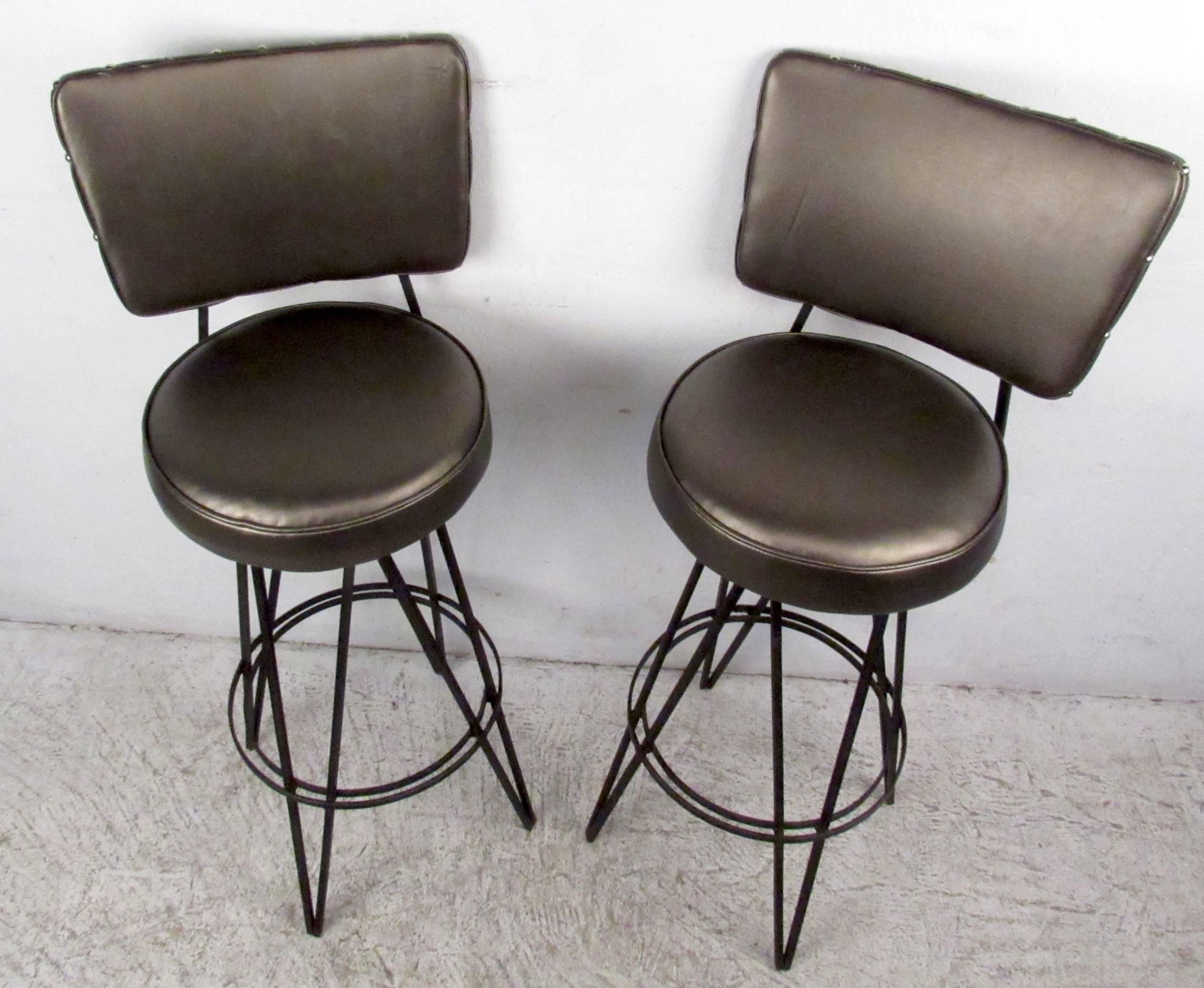 Two vintage modern hair pin iron stools with vinyl upholstery and swivel bases, designed in the manner of Frederick Weinberg.

Please confirm item location NY or NJ with dealer.