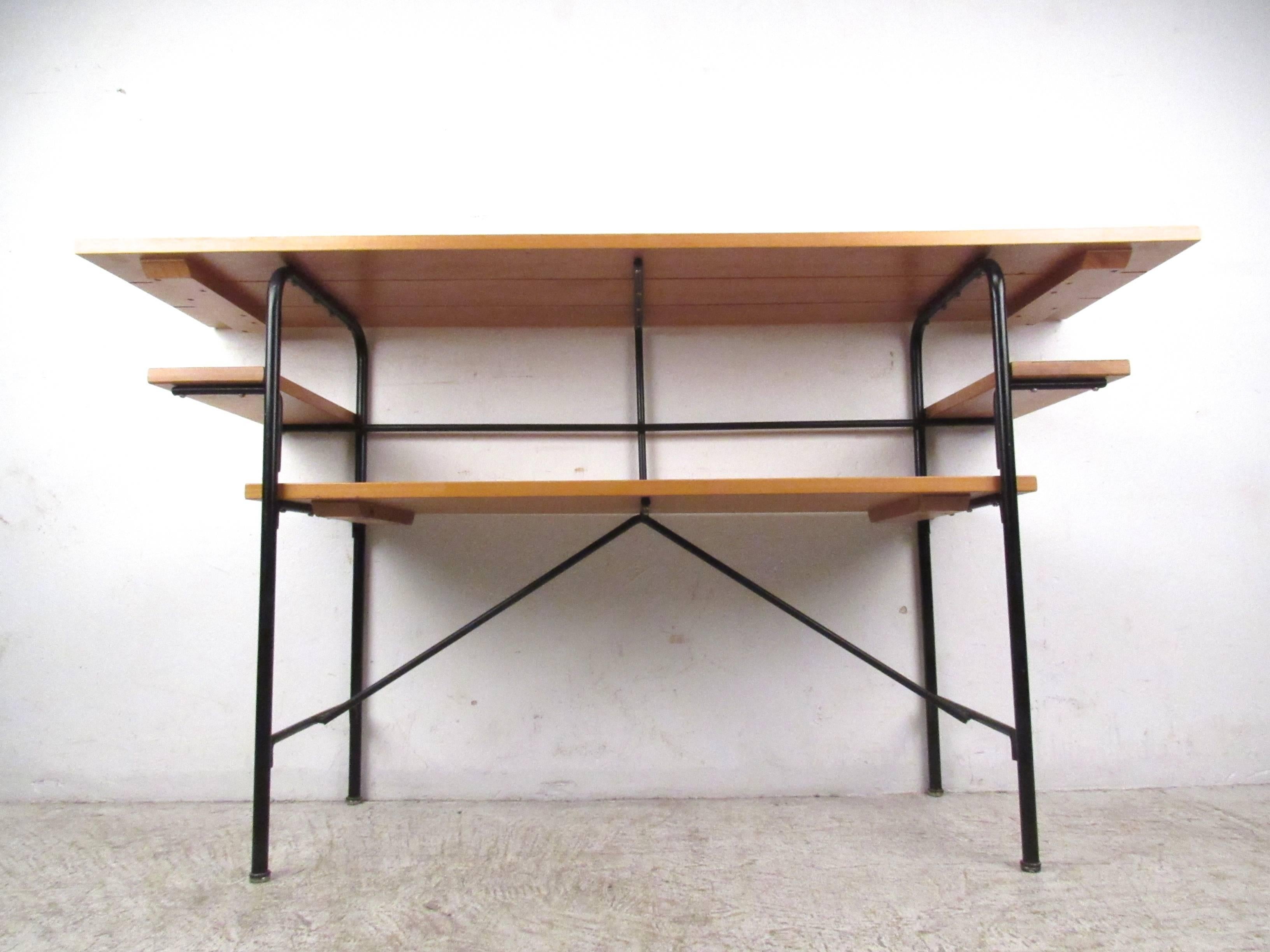 This unique multi-tier metal and slat desk offers a simplistic Mid-Century style design for any interior. Shelves for storage or workspace, this is a unique table option for computer use or storage. Please confirm item location (NY or NJ).