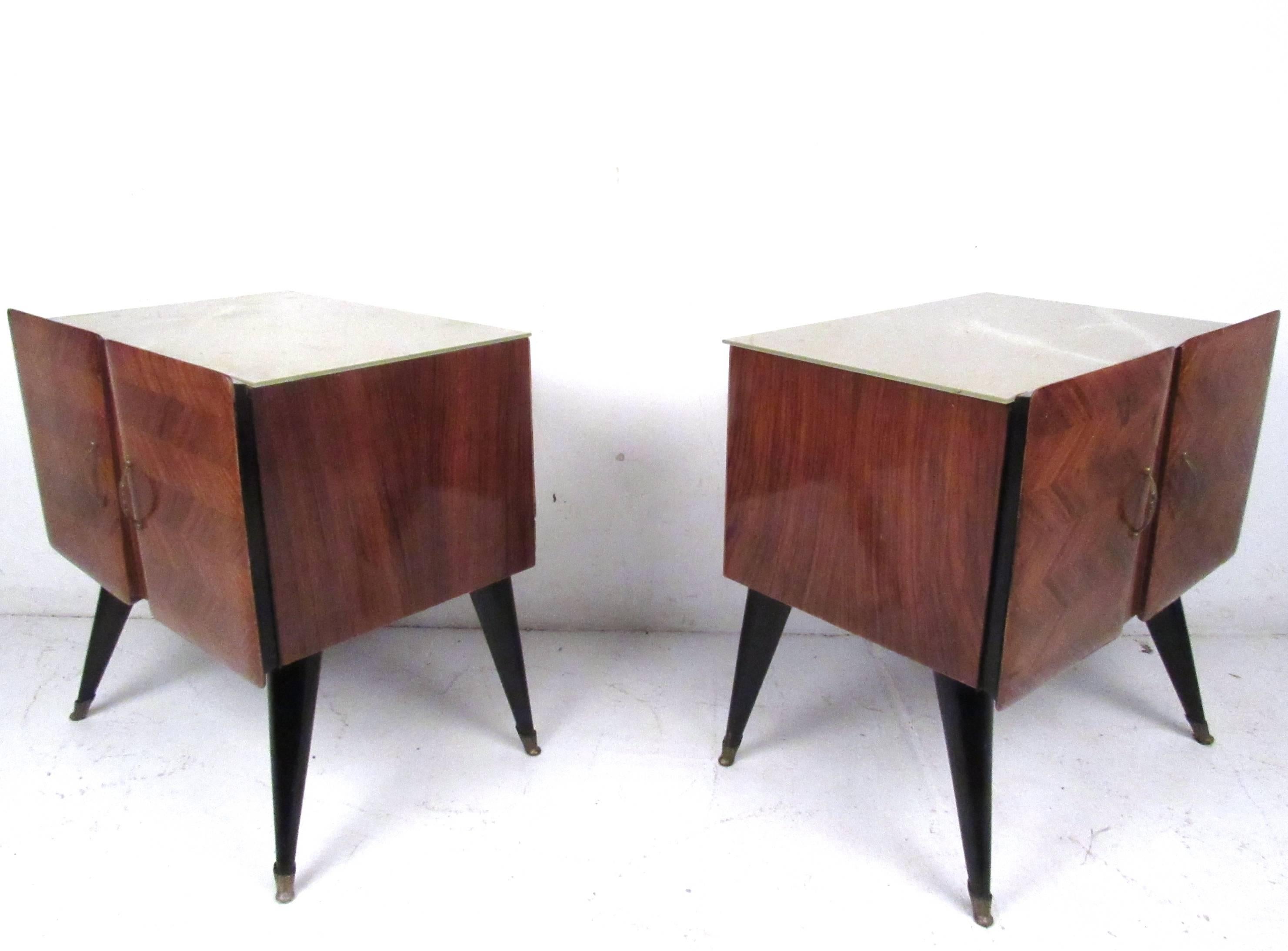 This stunning pair of Italian glass top nightstands make a beautiful addition to any room. Tapered legs, brass feet, and a beautiful vintage finish add to the charm of the pair. Unique glass tops add to it's charm, matching dresser available. Please