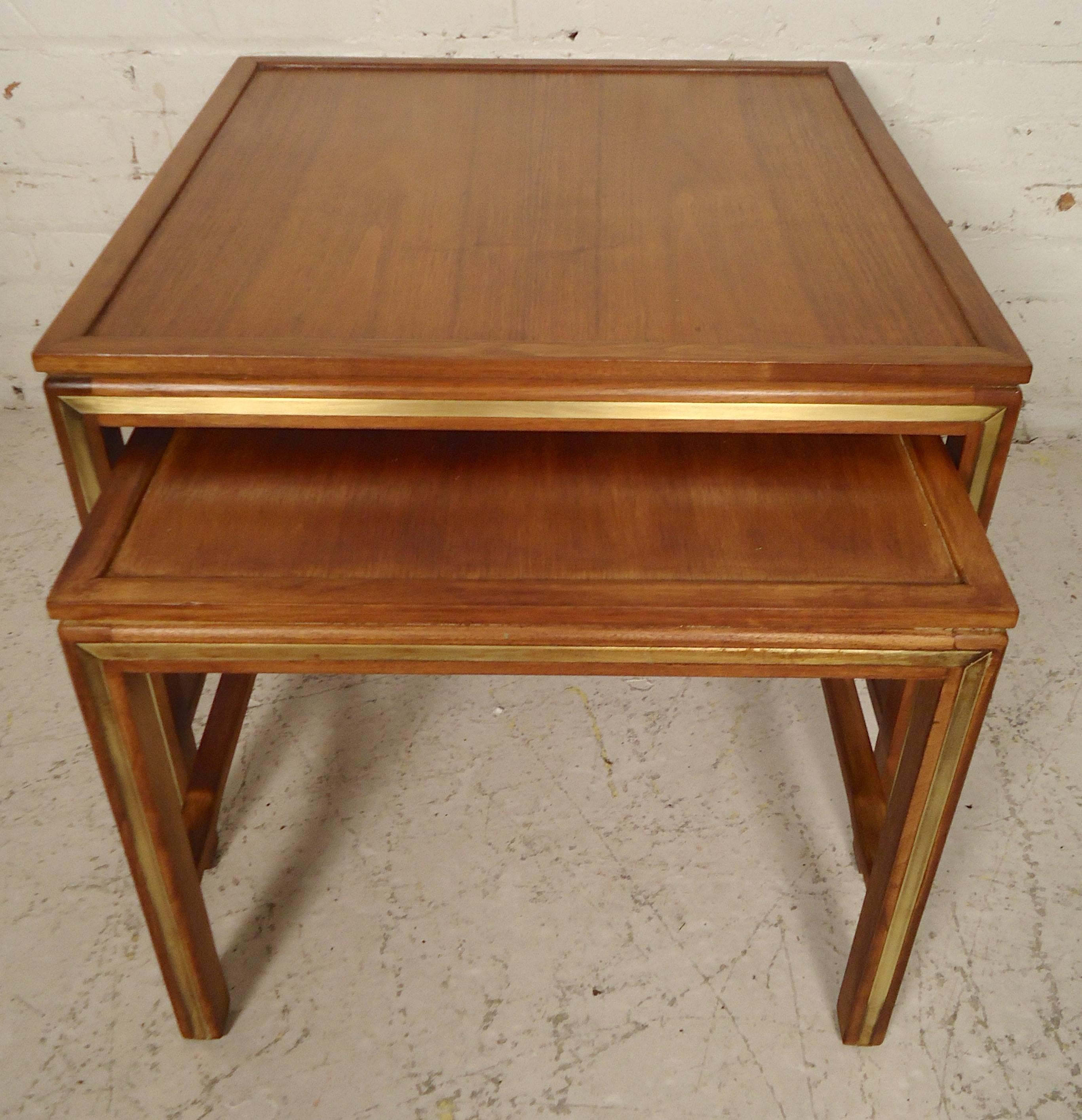 Gorgeous Mid-Century side tables by Widdicomb. Warm walnut grain and inlay brass trim.

(Please confirm item location - NY or NJ - with dealer).
 