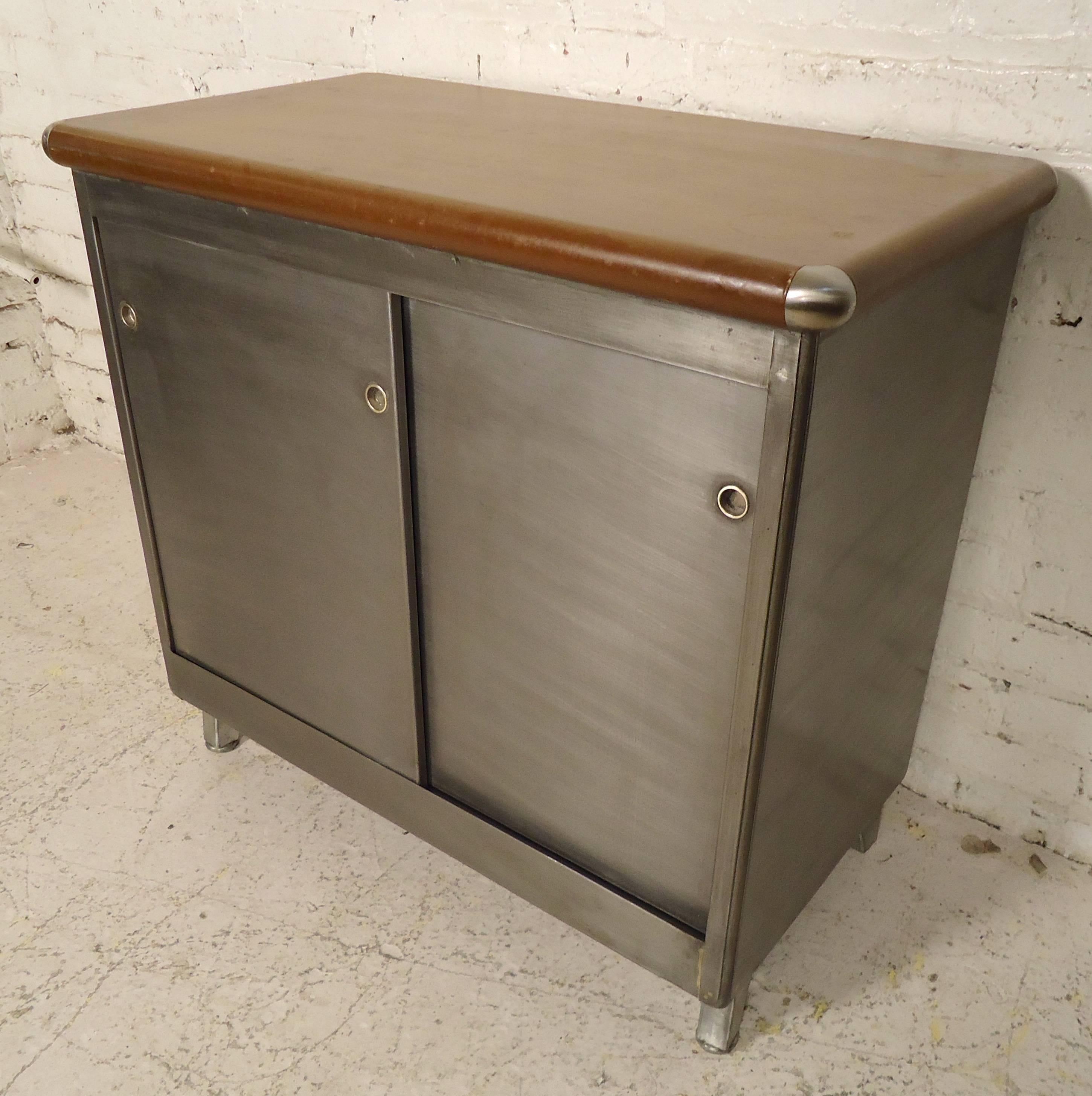 Refinished factory cabinet with vinyl top. Double sliding doors with adjustable shelves.

(Please confirm item location - NY or NJ - with dealer).
     
